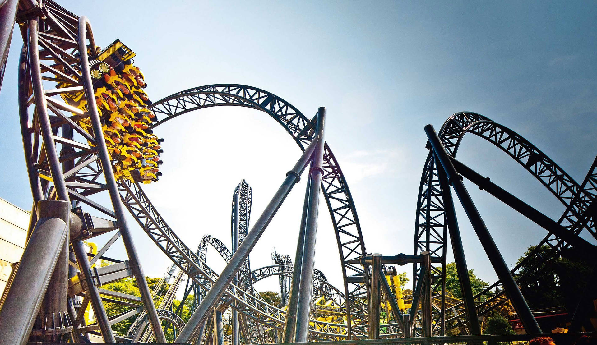 Roller Coaster With Yellow Wagons Background