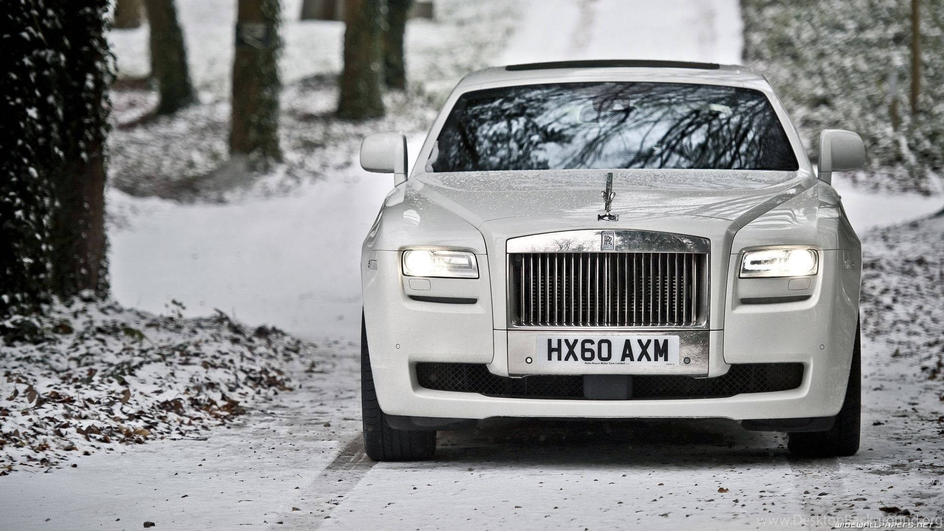Rolls Royce White In Snow Background