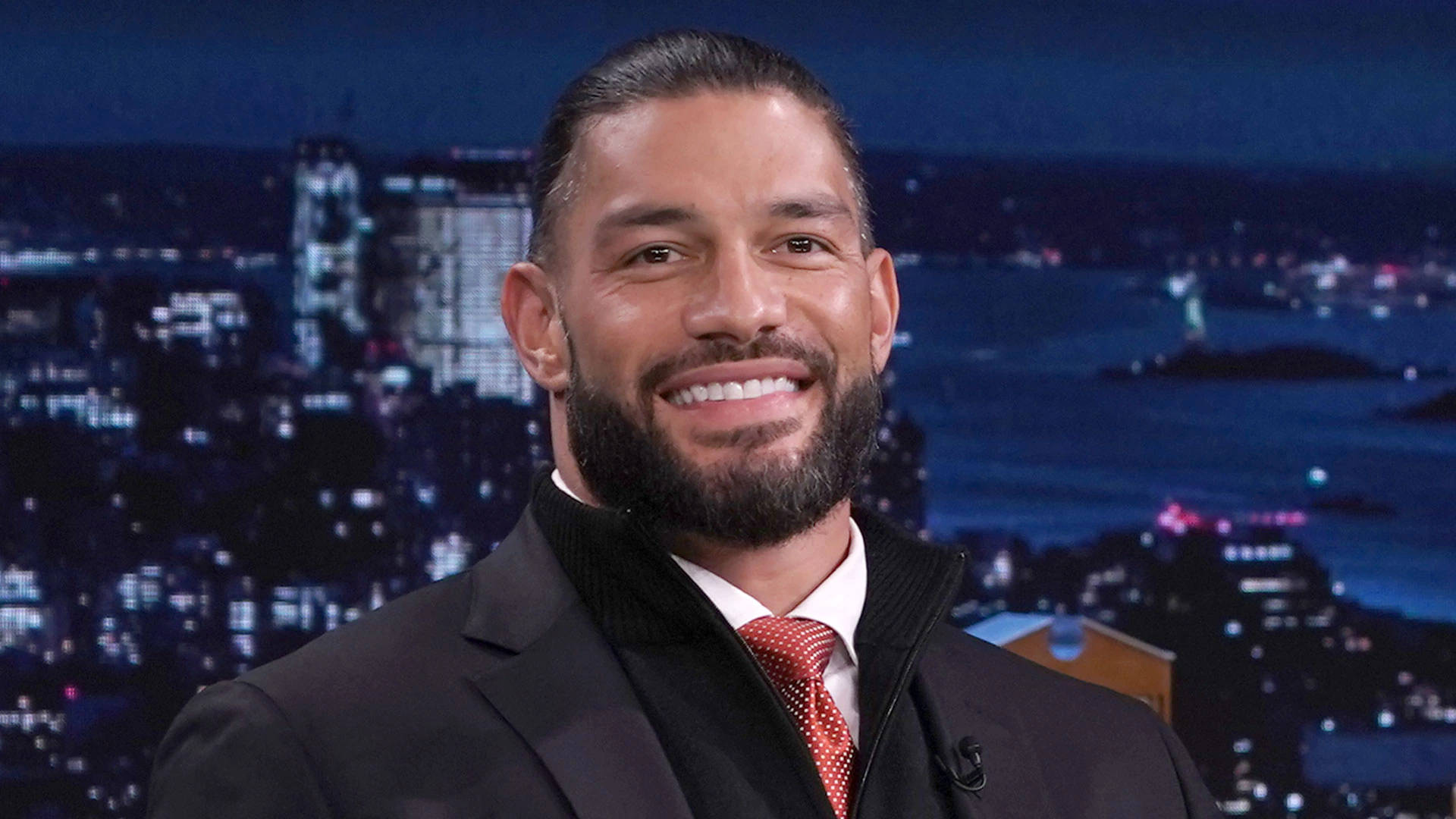 Roman Reigns At Jimmy Fallon Show Background