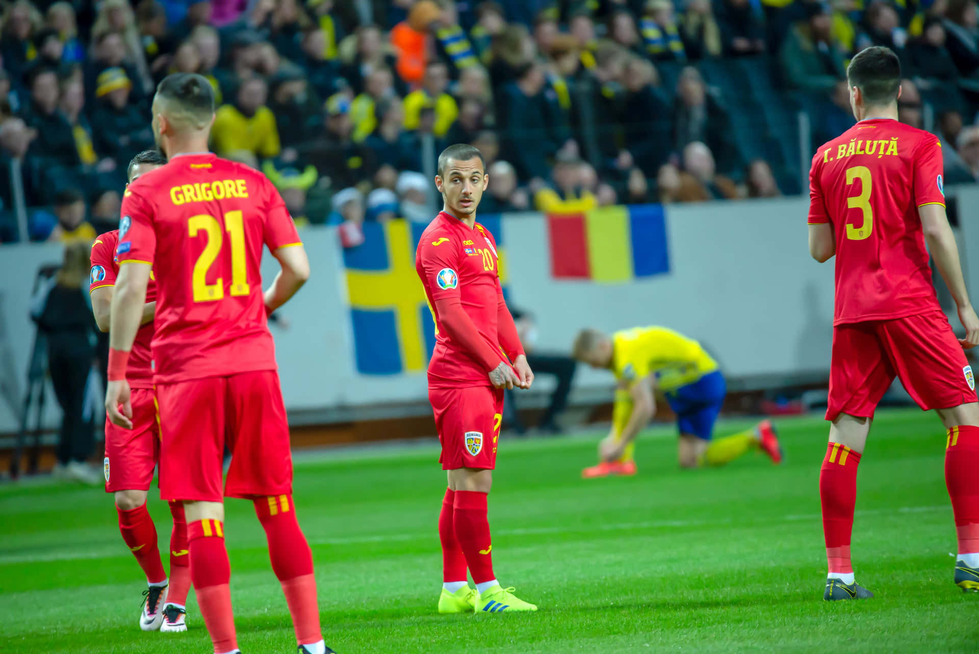 Romanian Football Team Playerson Field Background