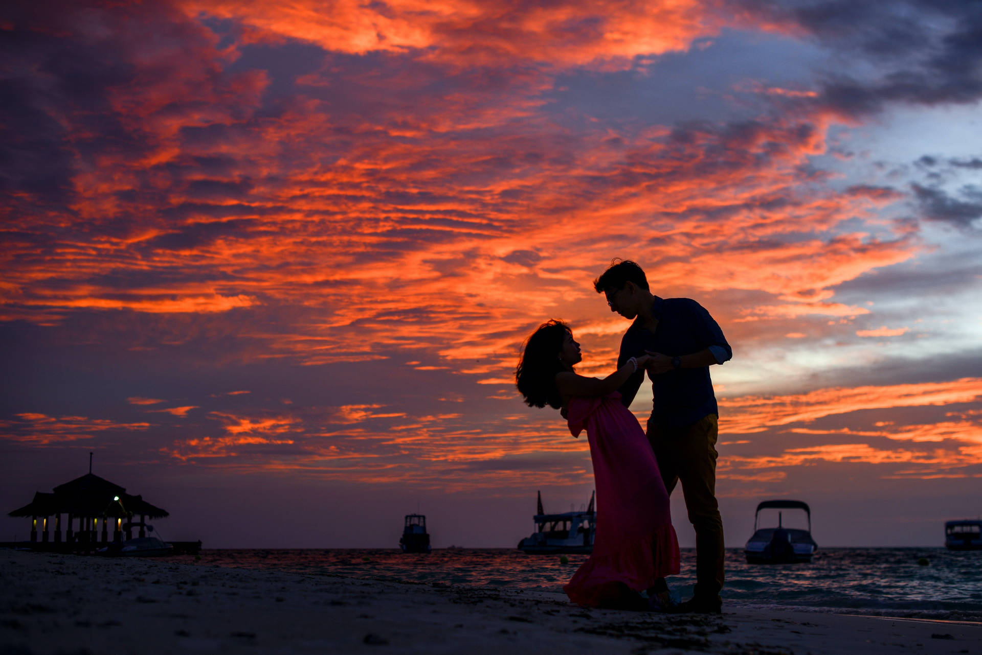 Romantic Couple Beach Dance At Dusk Background