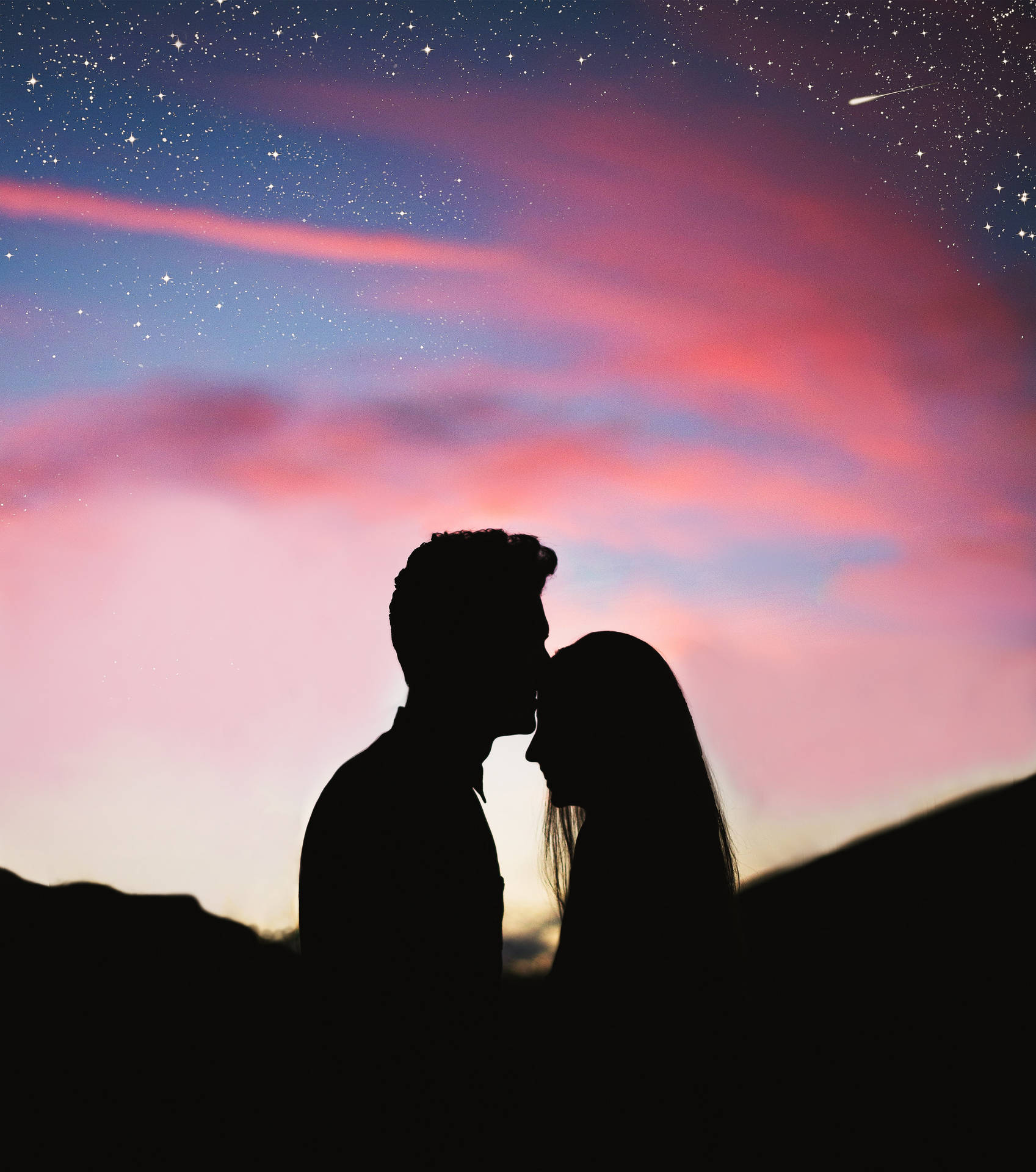 Romantic Couple Forehead Kiss Under Pink Skies Background