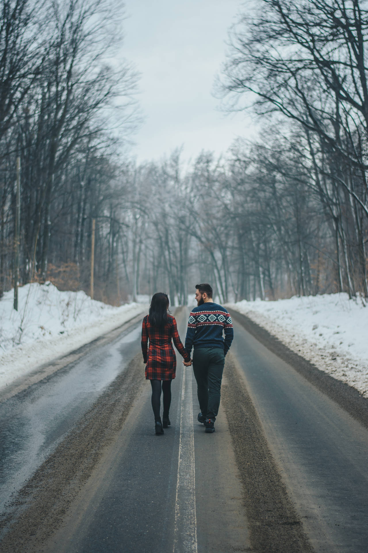 Romantic Couple Holding Hands On Road Background