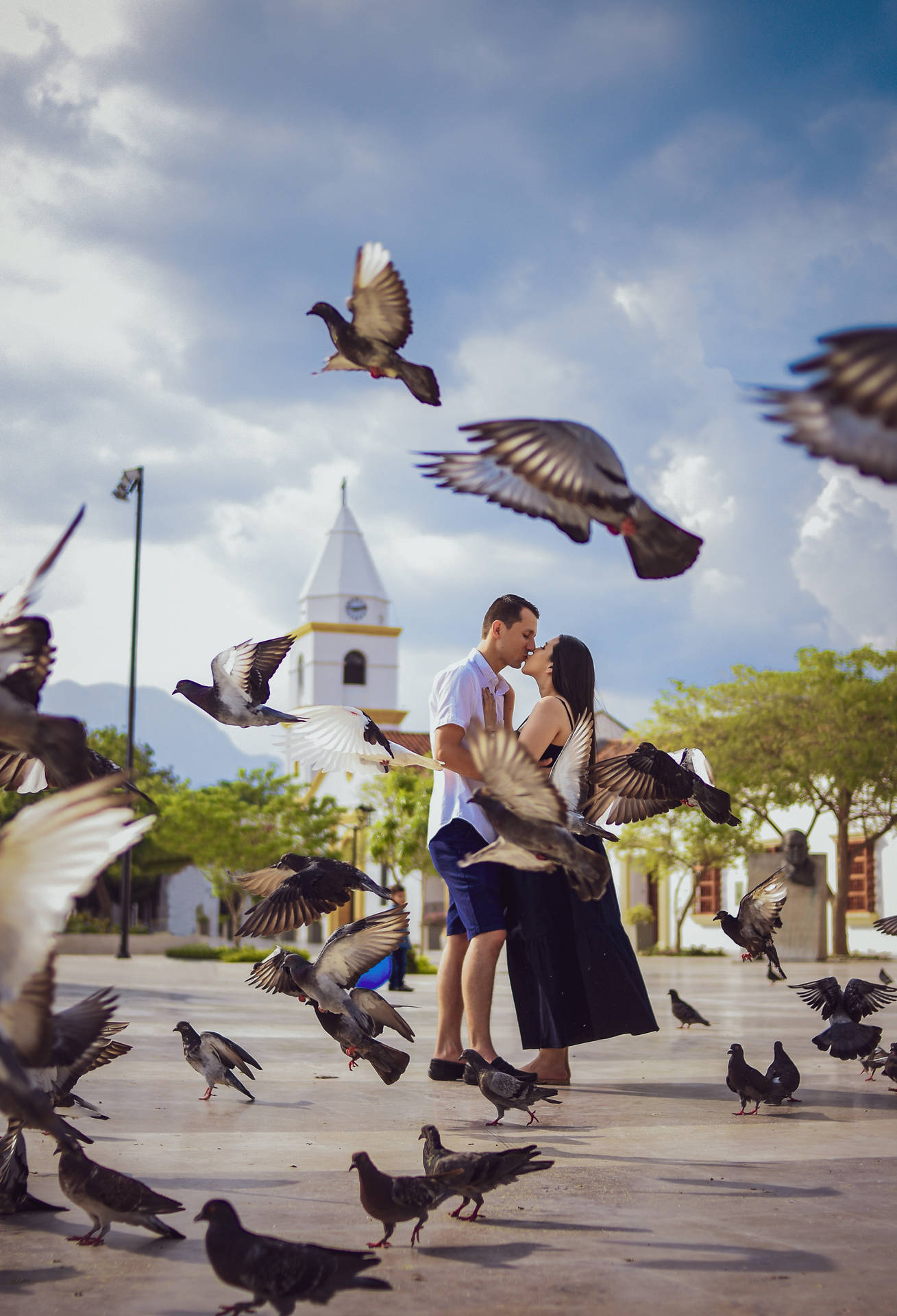 Romantic Couple Kiss With Flock Of Birds