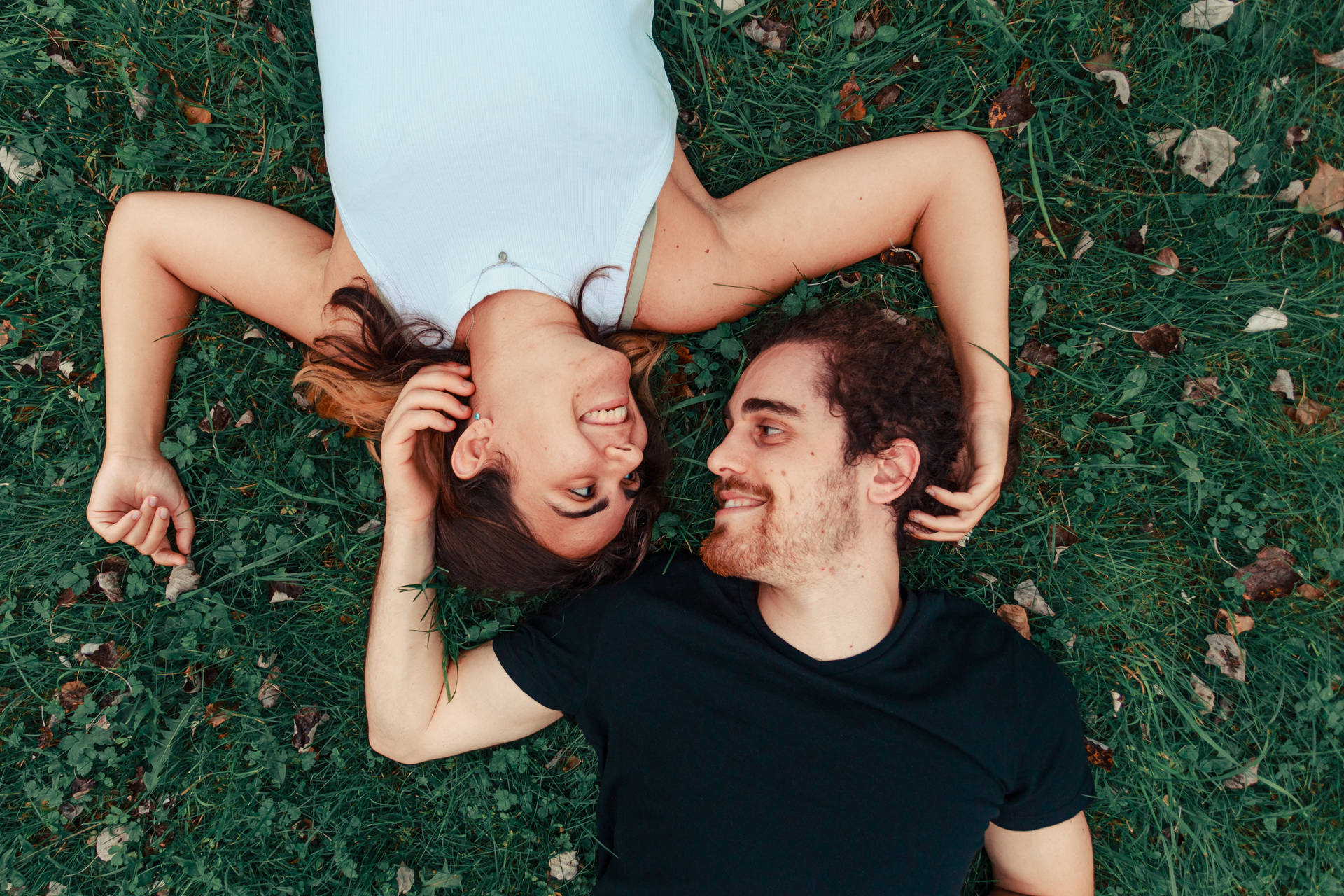 Romantic Couple Lying On The Ground Background