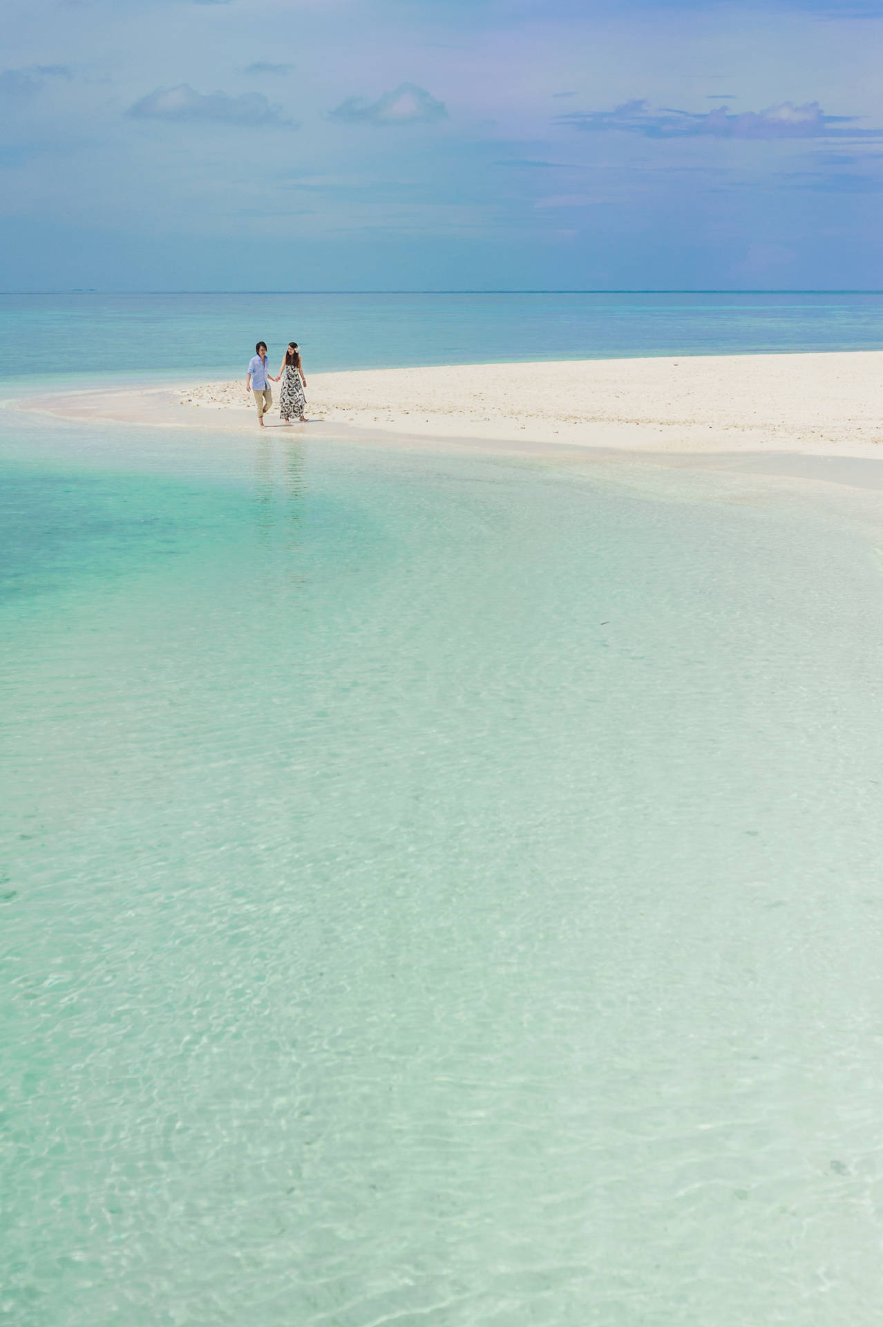 Romantic Couple On White Beach Sand