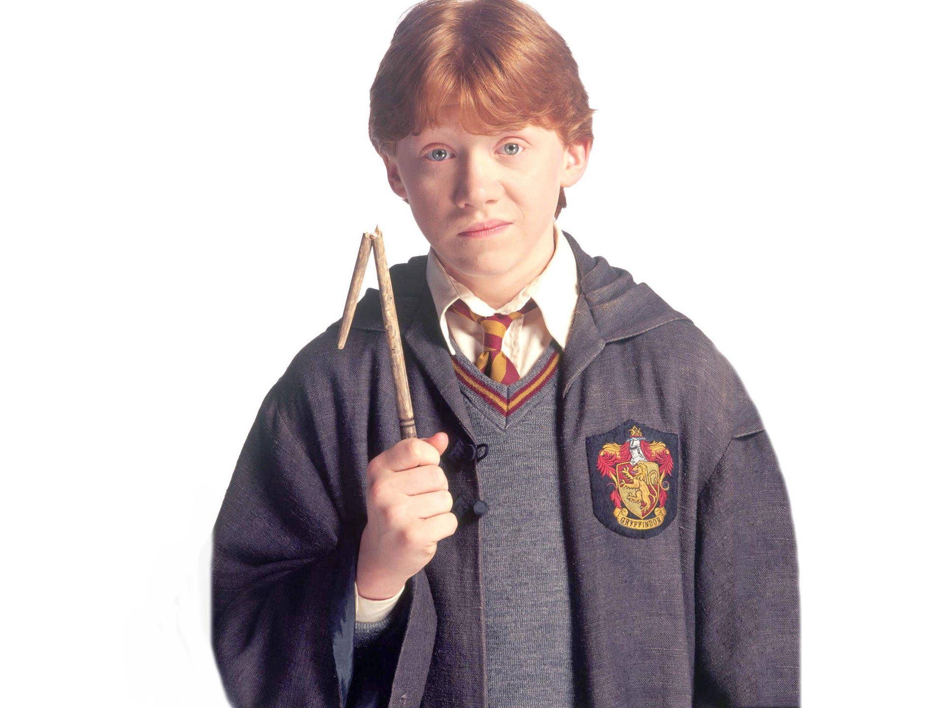 Ron Weasley Staring At His Broken Wand In Frustration Background