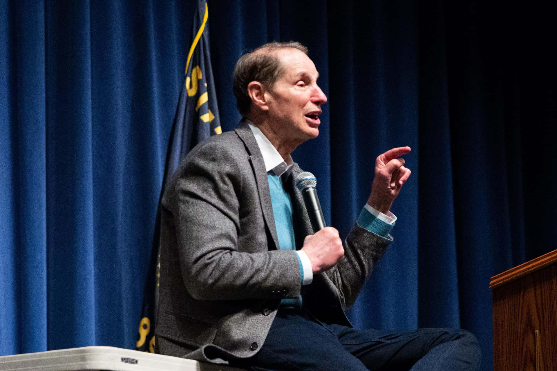 Ron Wyden Holding A Microphone Background