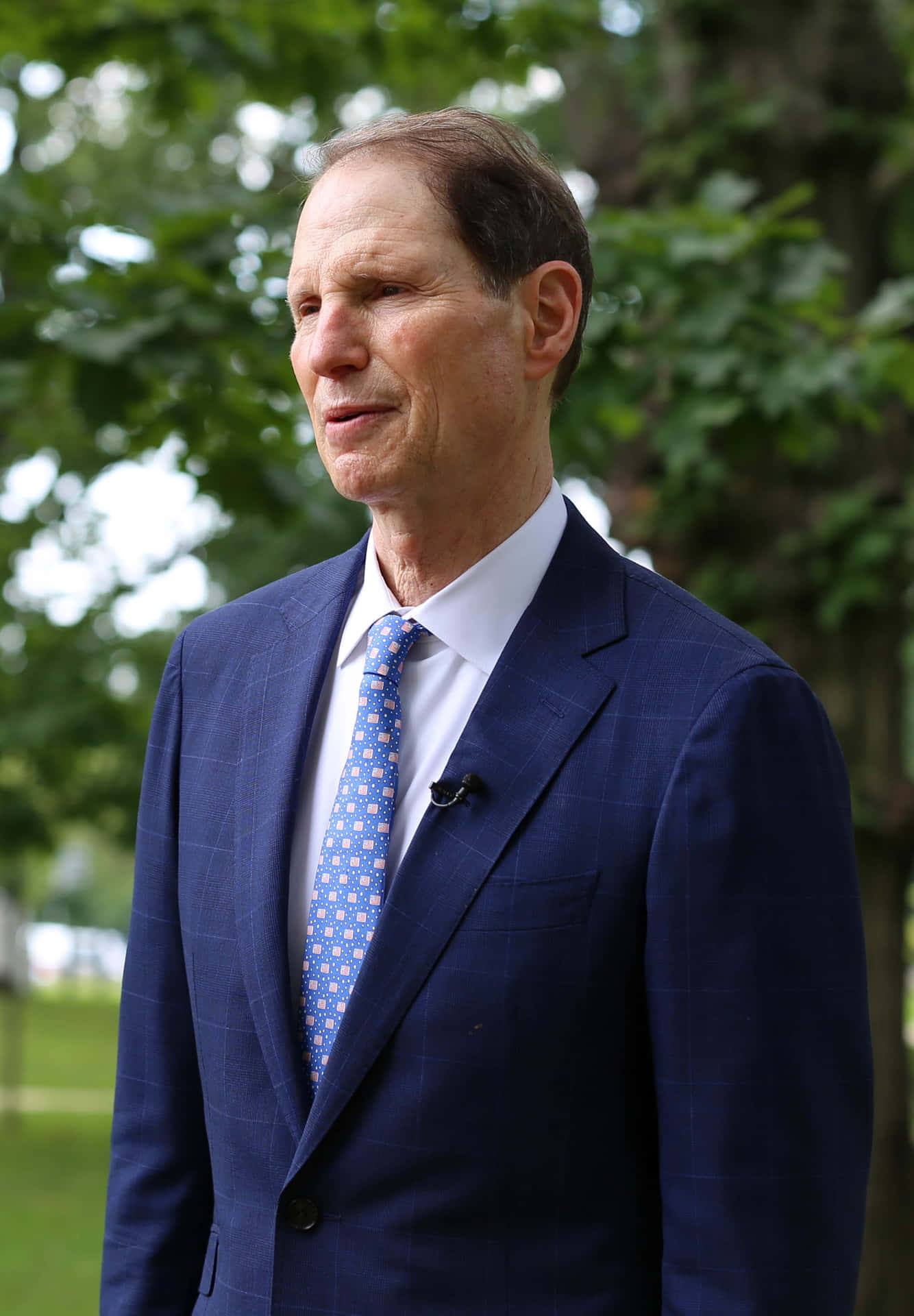 Ron Wyden In A Blue Suit Background
