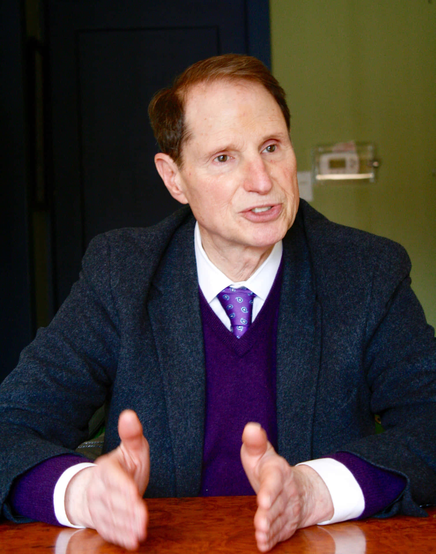 Ron Wyden With Purple Sweater Background