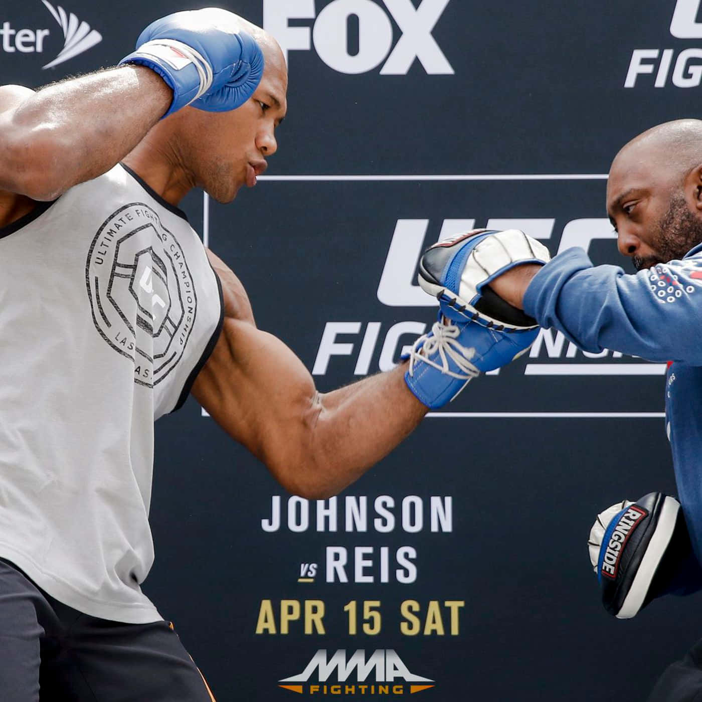 Ronaldo Souza Delivering A Powerful Punch During Training Background