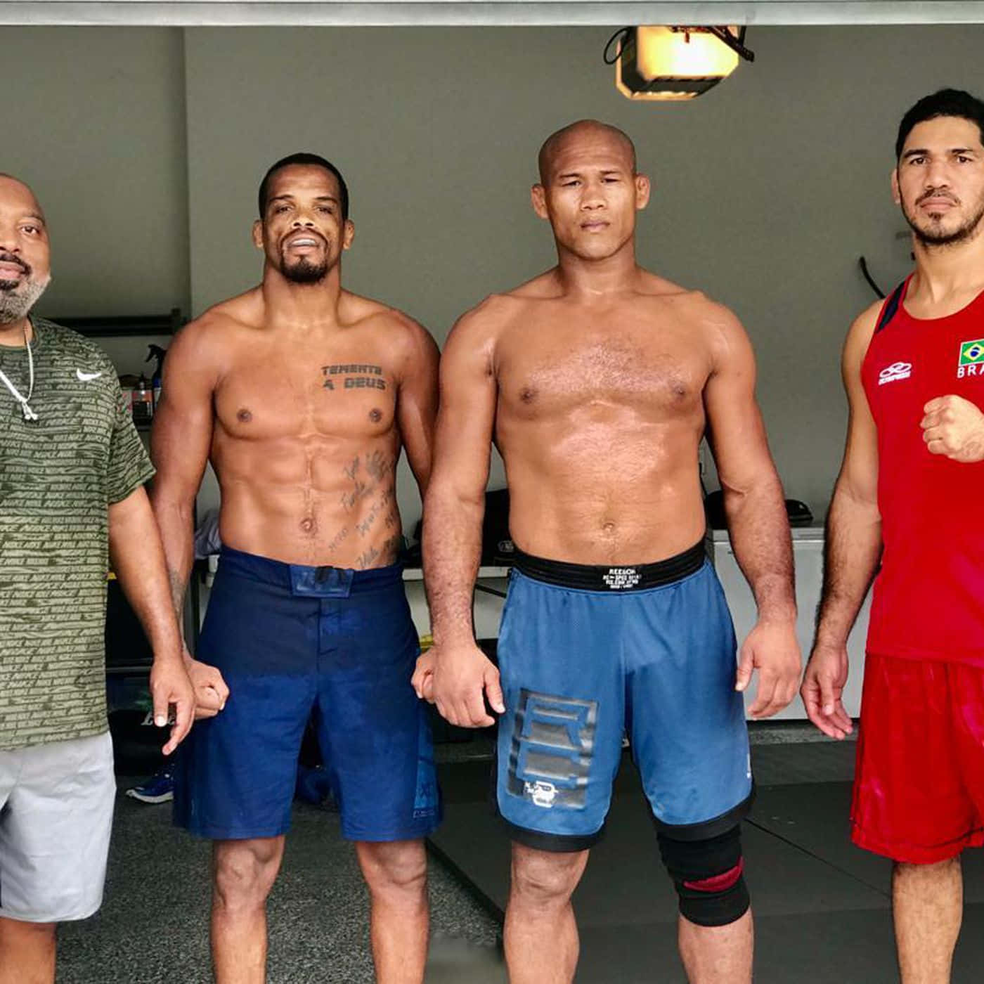 Ronaldo Souza Poses With His Team After A Successful Match Background