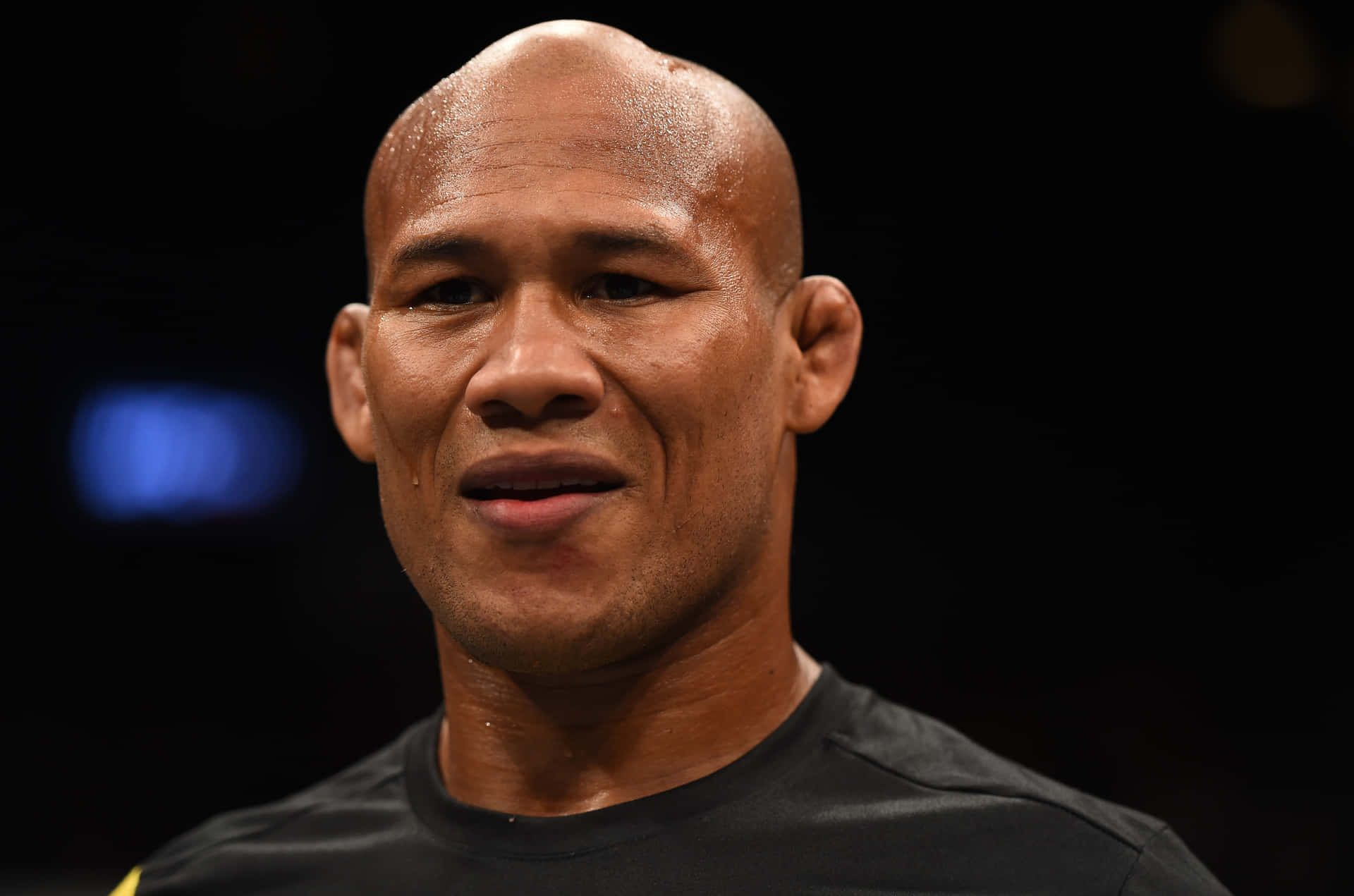 Ronaldo Souza Smiling In Ufc Octagon Background