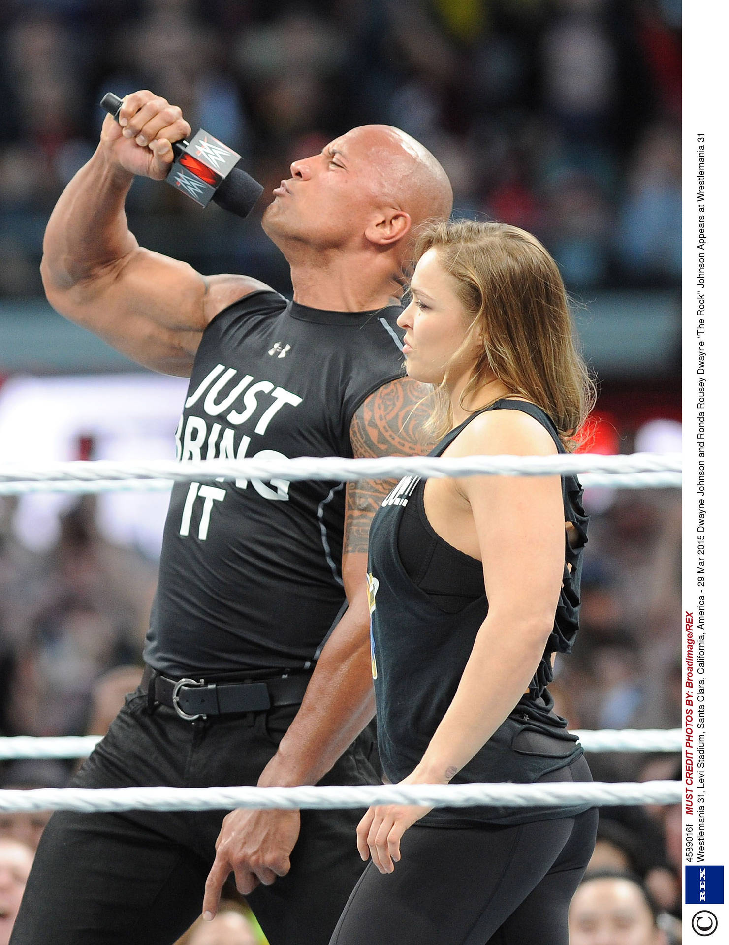Ronda Rousey With The Rock Background