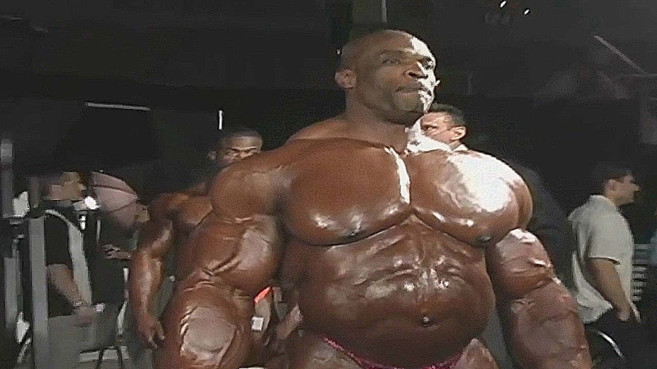 Ronnie Coleman Showing Off Tanned Body Background