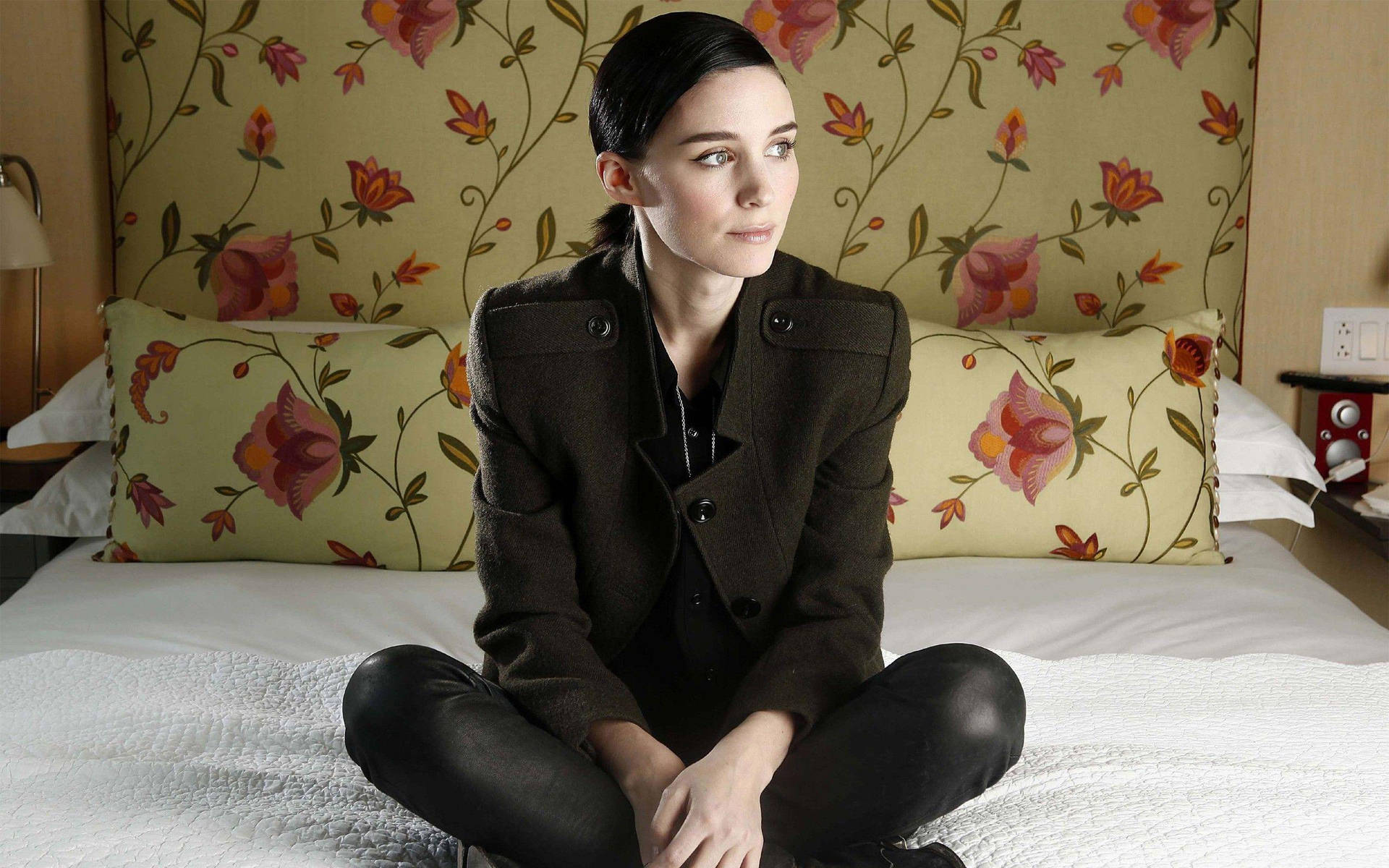 Rooney Mara Sitting On Bed Background