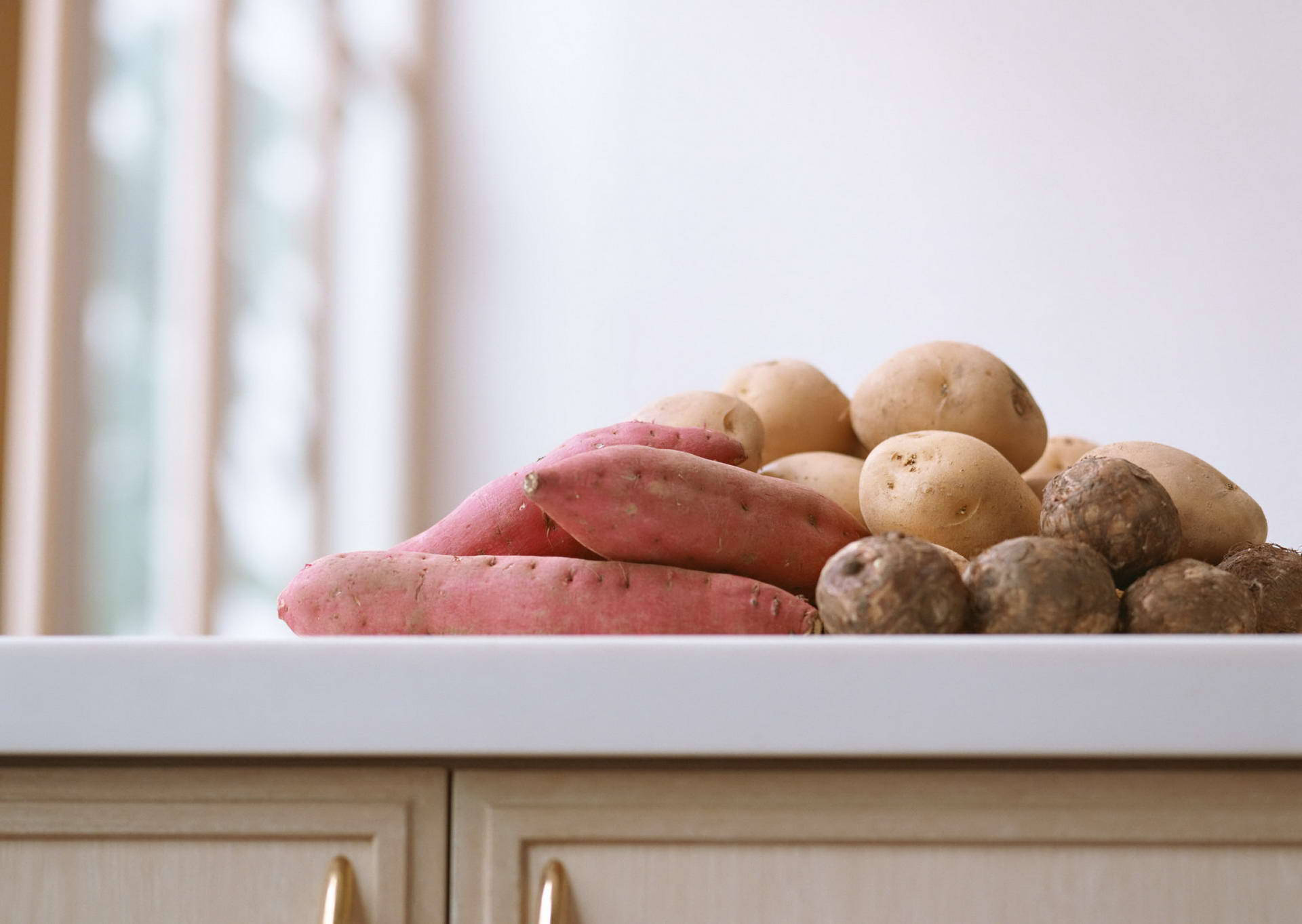 Root Vegetables On Counter Background