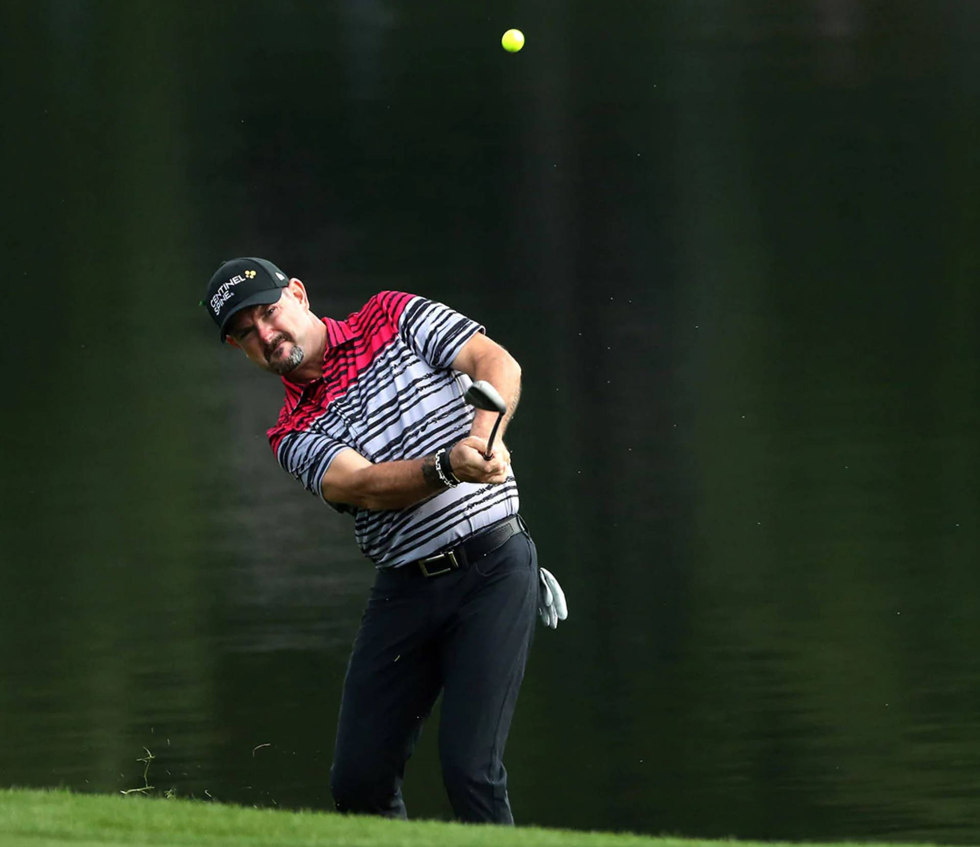 Rory Sabbatini Hitting The Golf Ball Background