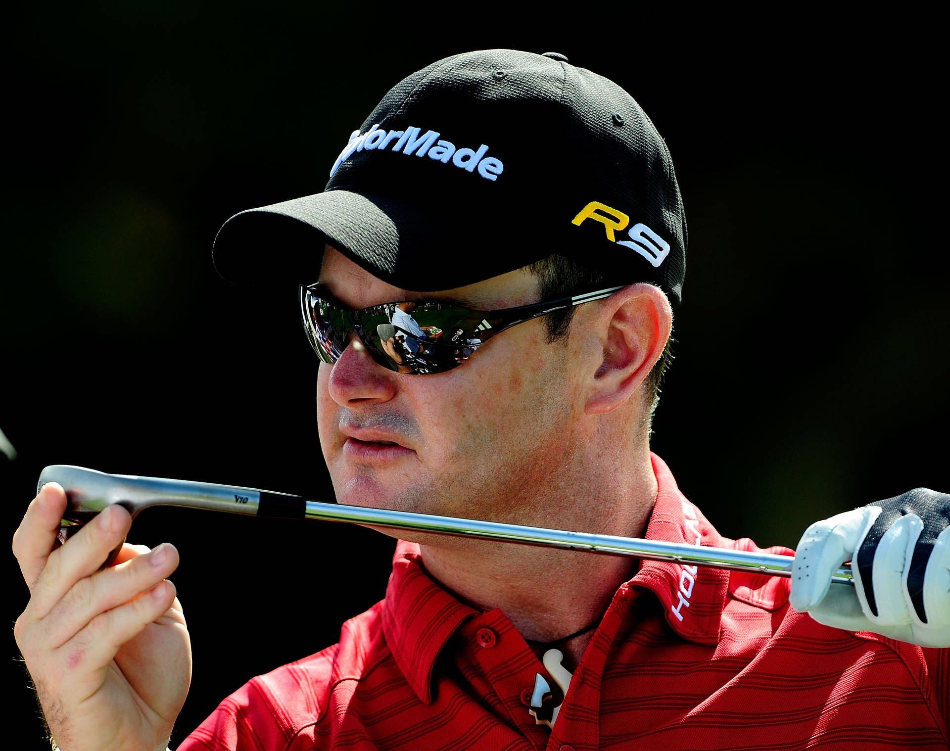 Rory Sabbatini Meticulously Inspecting His Golf Club Background