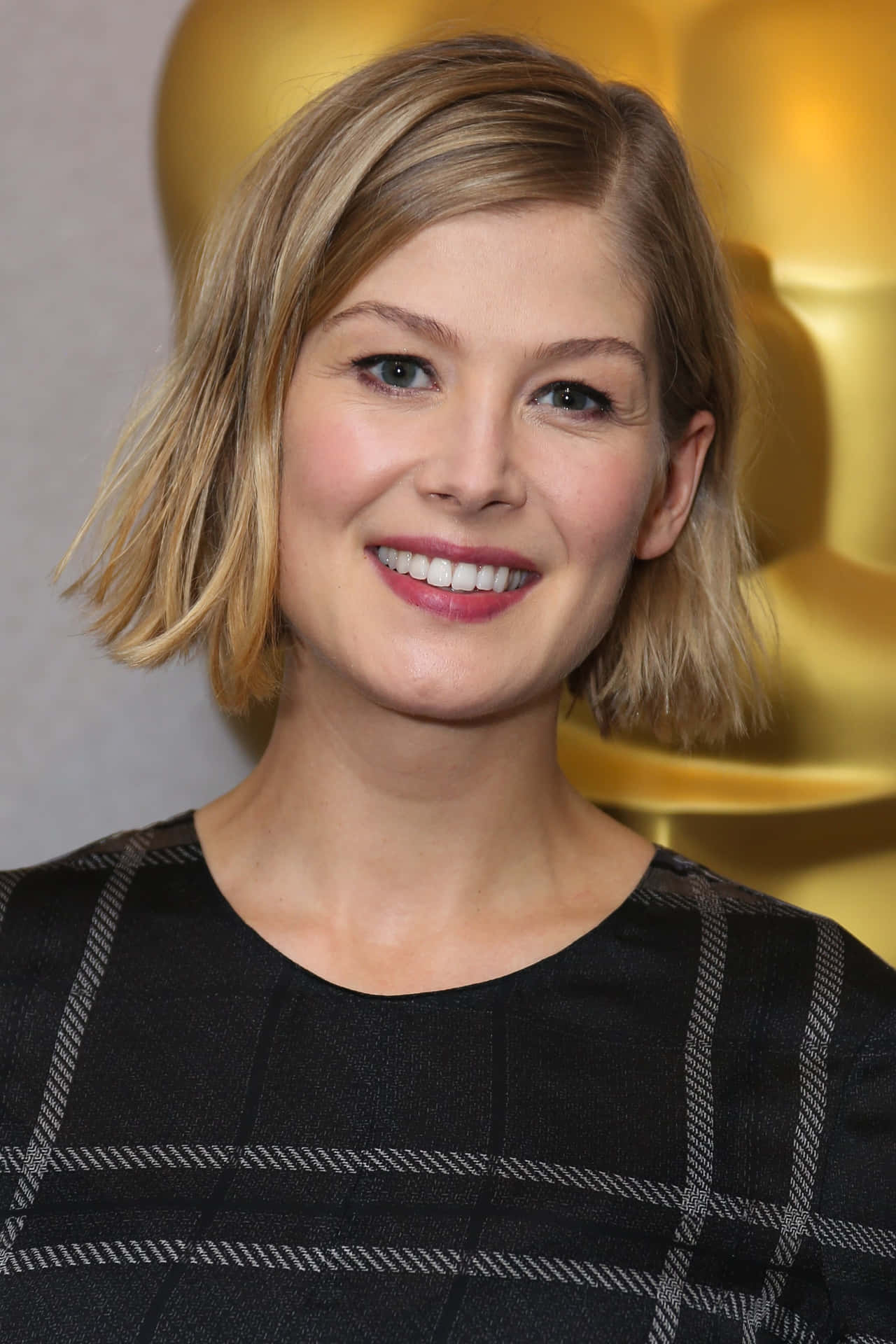 Rosamund Pike At A Red Carpet Event Background