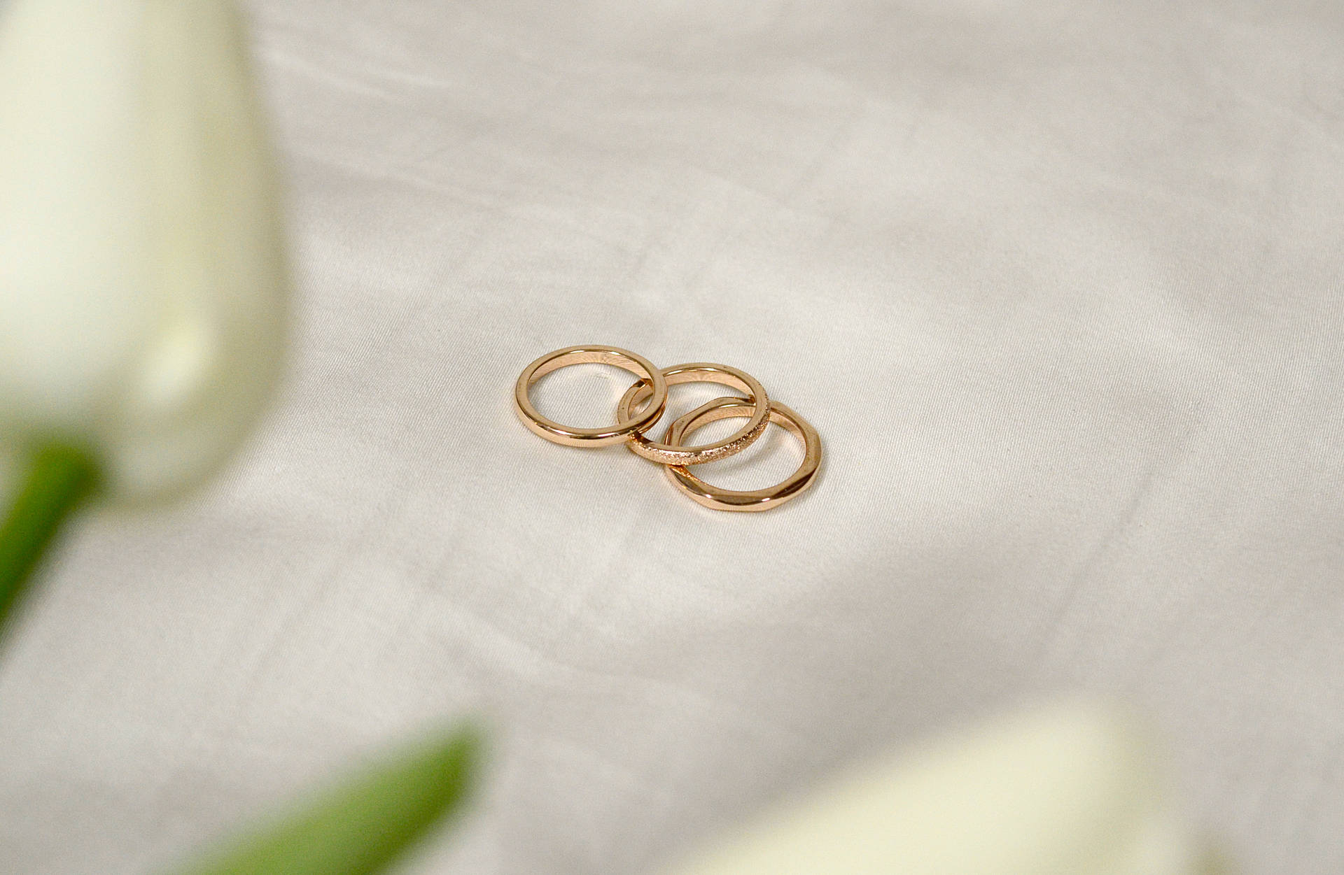 Rose Gold Trio Rings Background