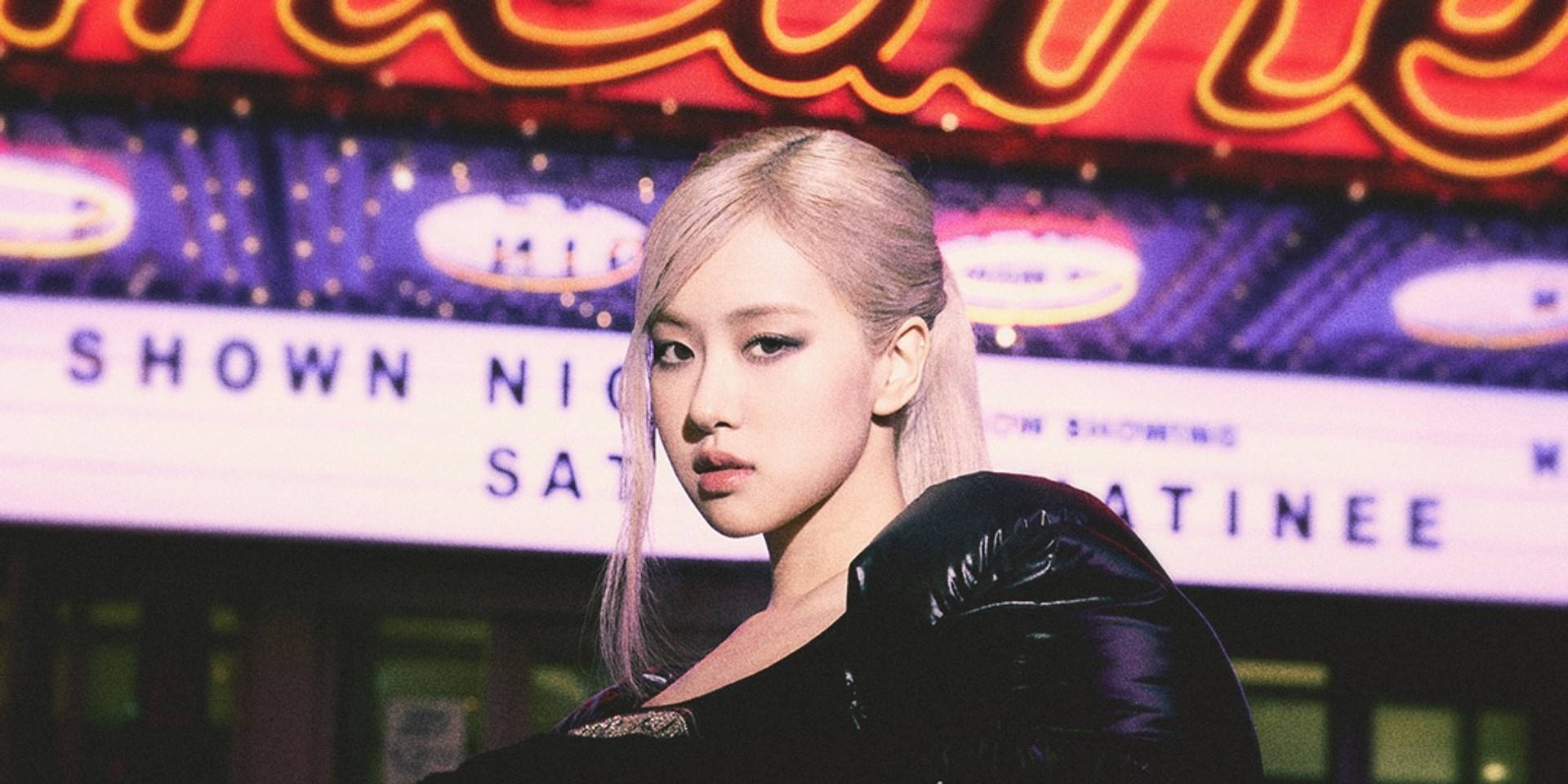 Roseanne Park Showcasing A Stylish Ponytail Hairstyle. Background