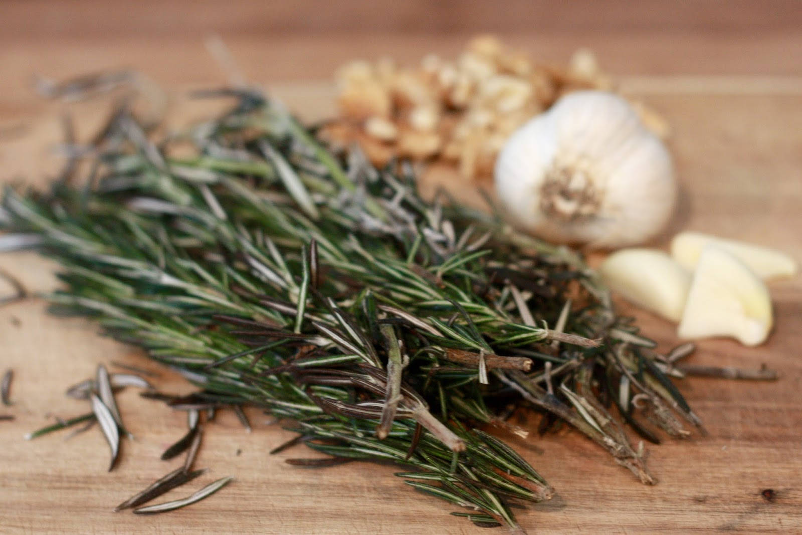 Rosemary And Garlic On Wood Background