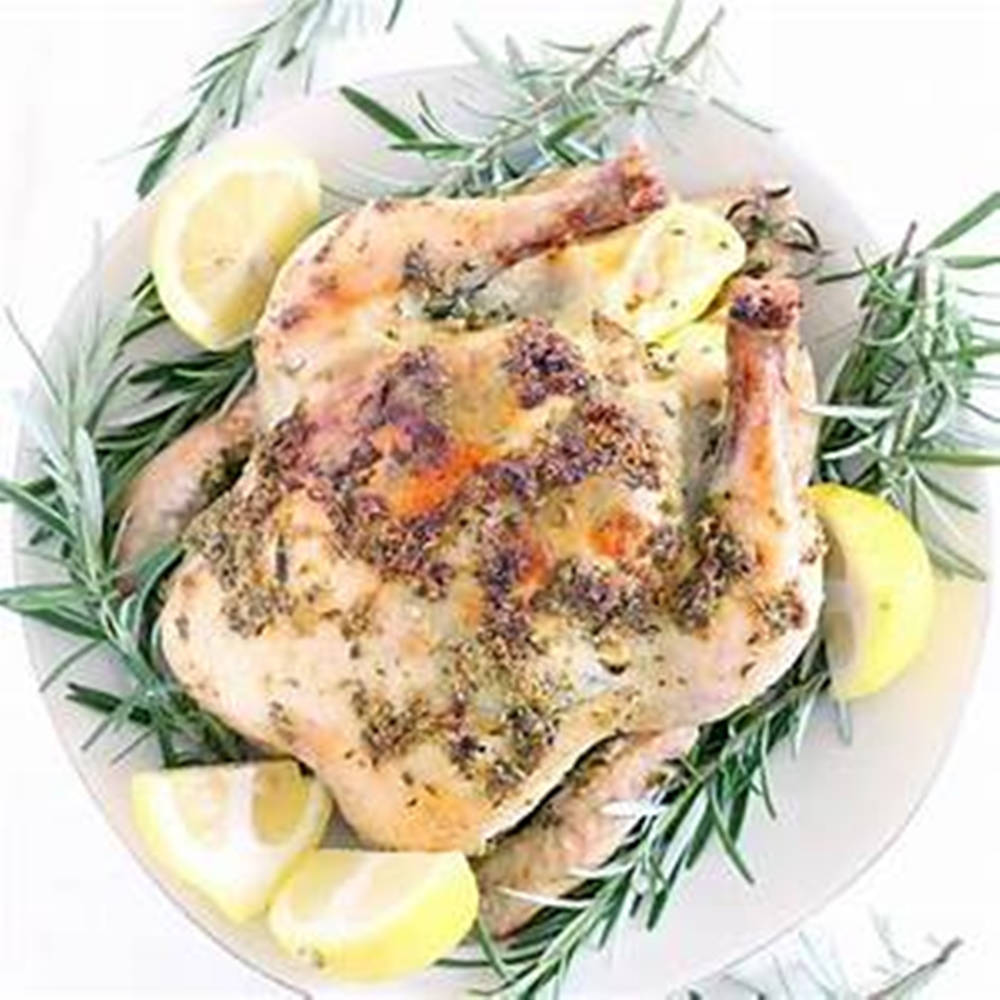 Rosemary And Lemon On Whole Roast Chicken Background