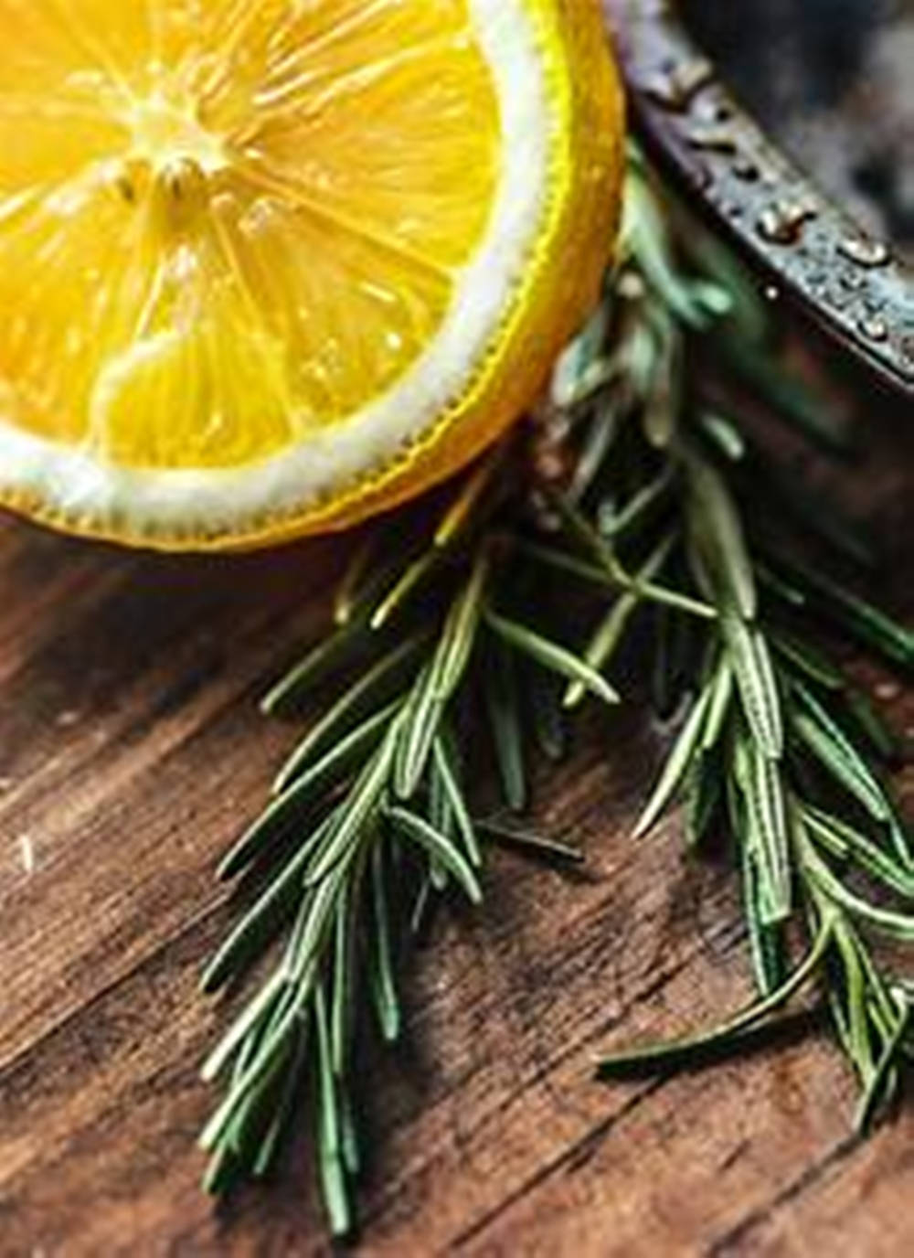 Rosemary And Lemon On Wood Background