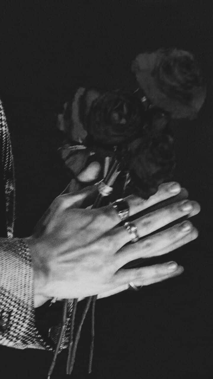 Roses On Hands Of Harry Styles Black And White Background