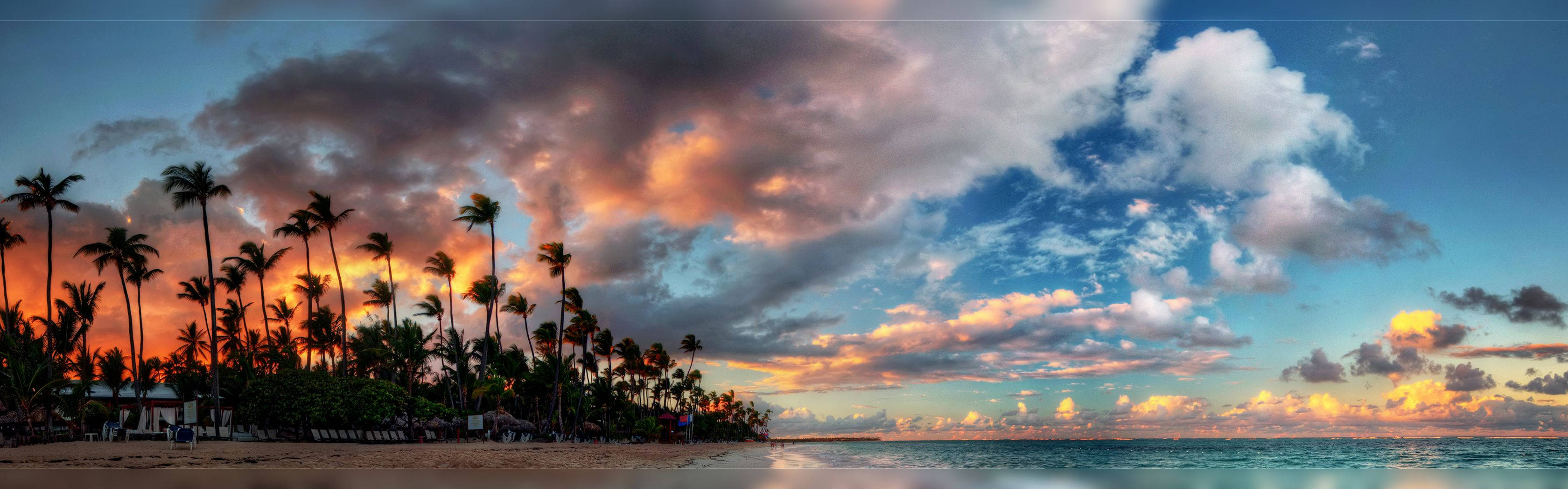 Rosy Sky Tropical Beach Dual Screen Background