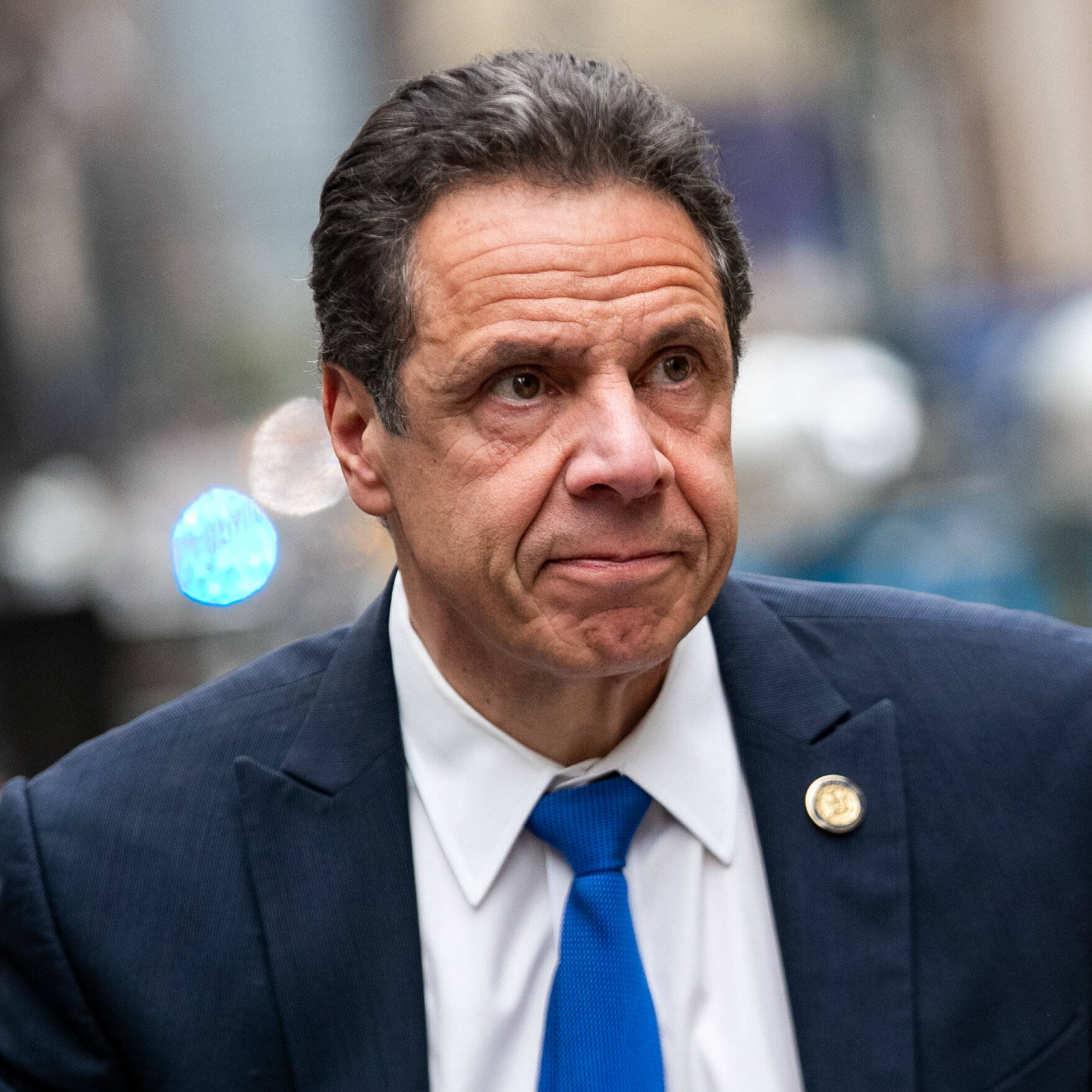 Round Pin On Andrew Cuomo's Suit Background