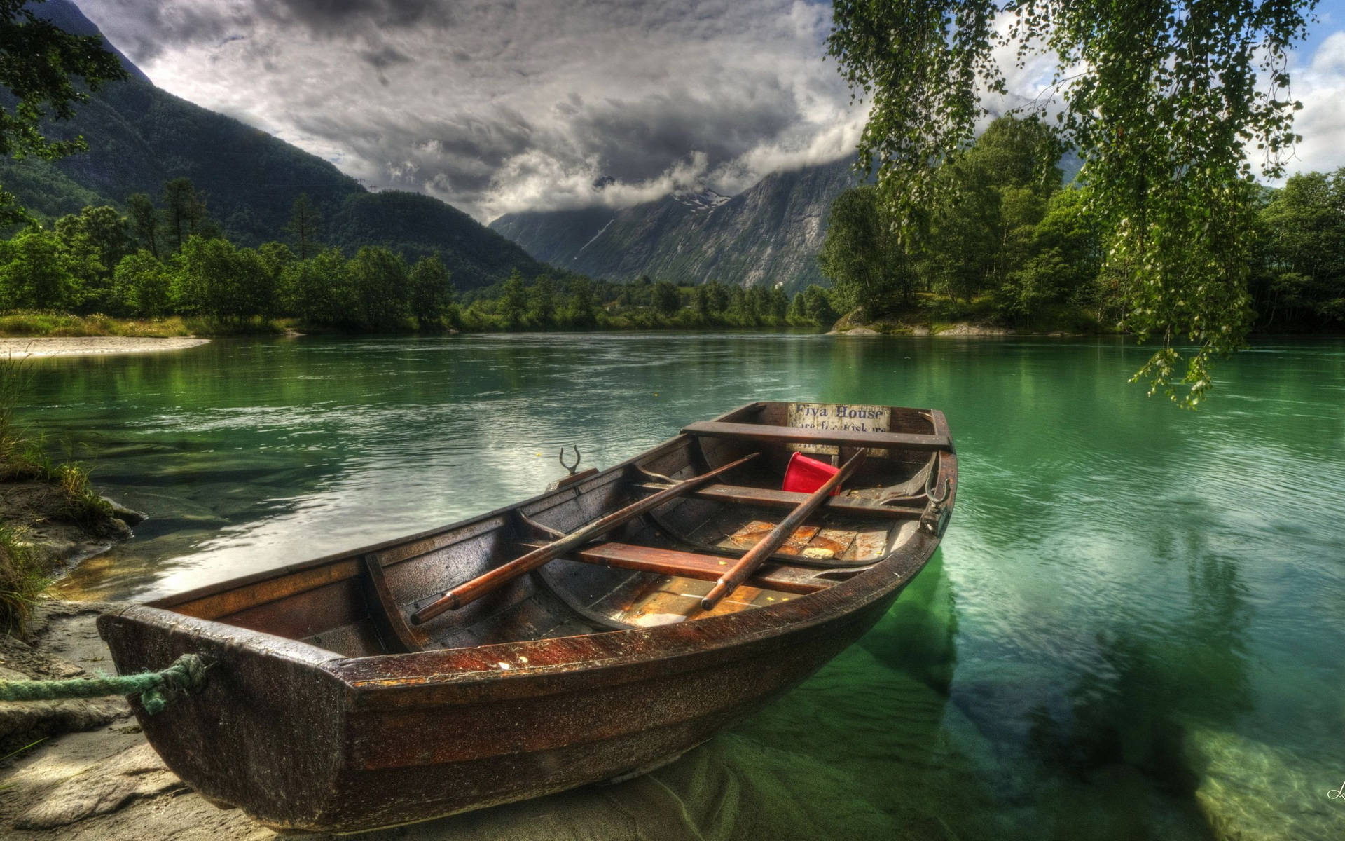 Row Boat On Green Lake Background