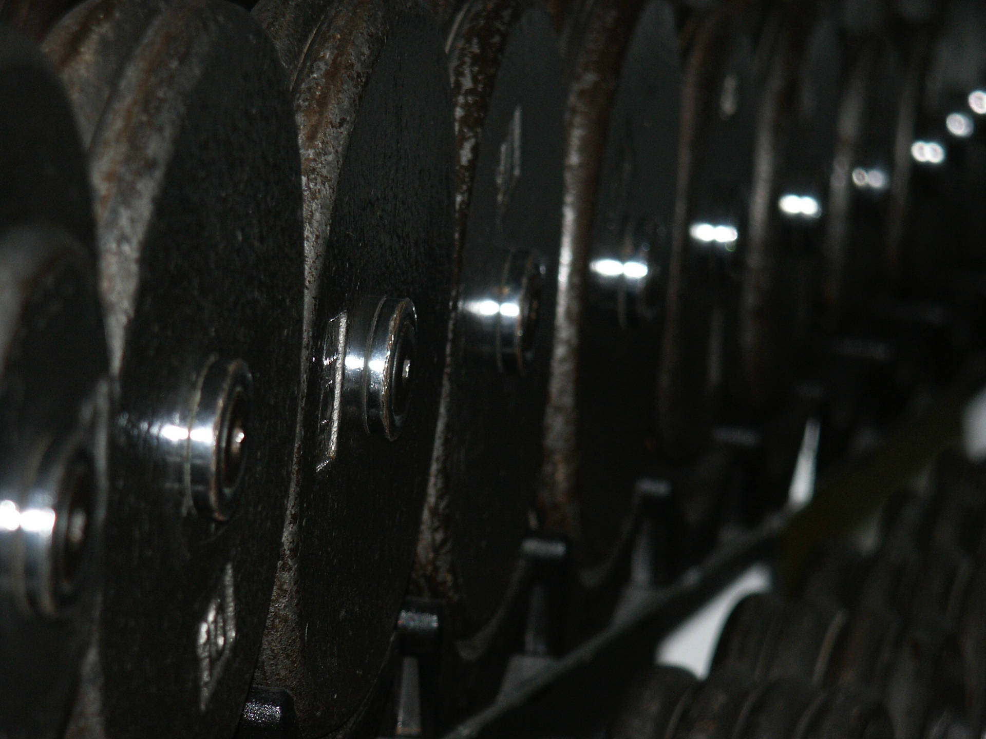 Row Of Rusty Barbell Plates Background