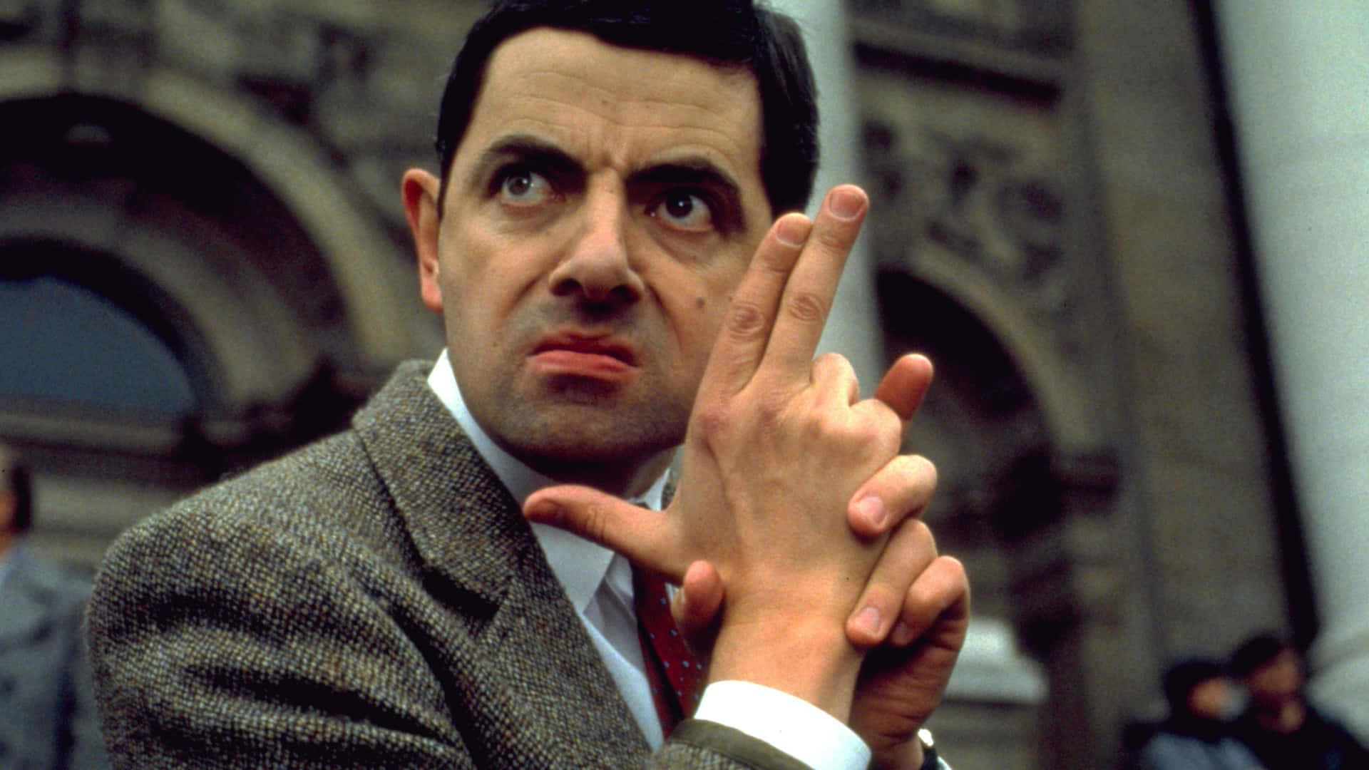 Rowan Atkinson Comedic Gesture Background