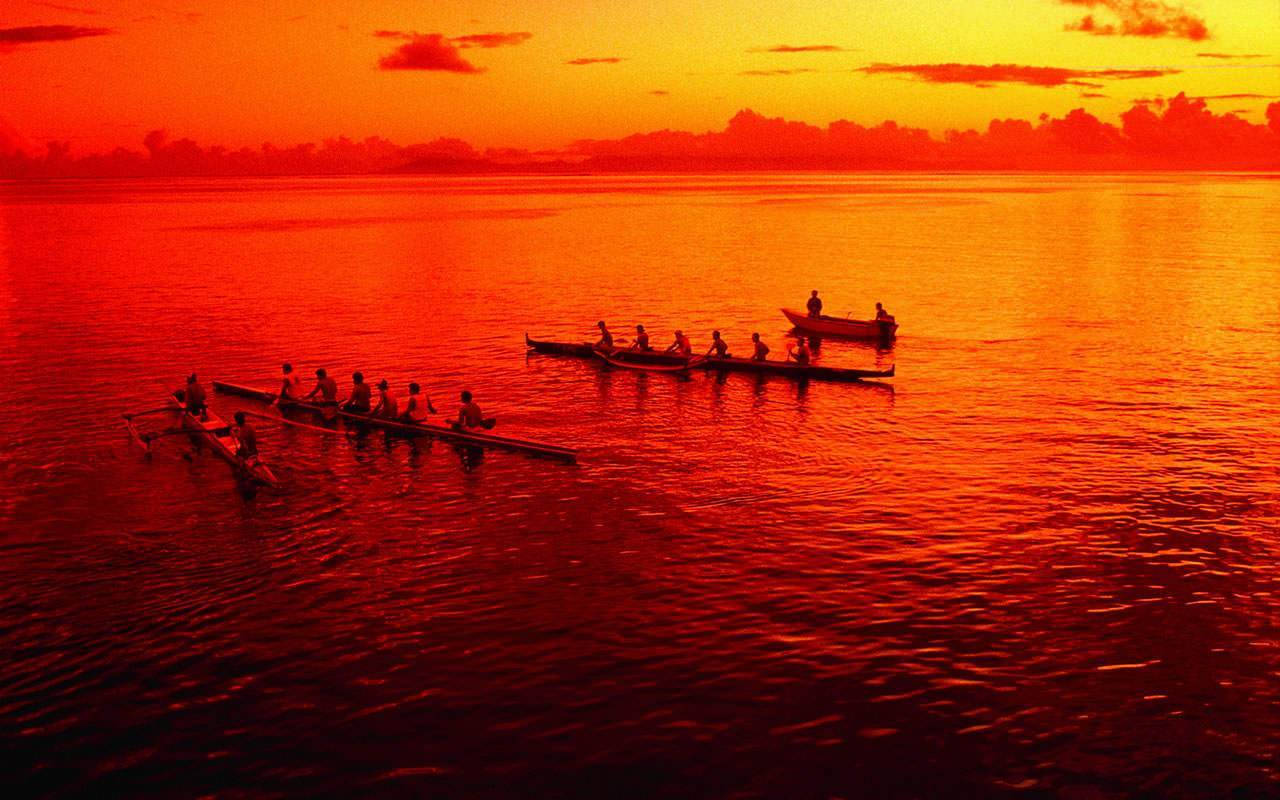 Rowing Crew In Sunset Background