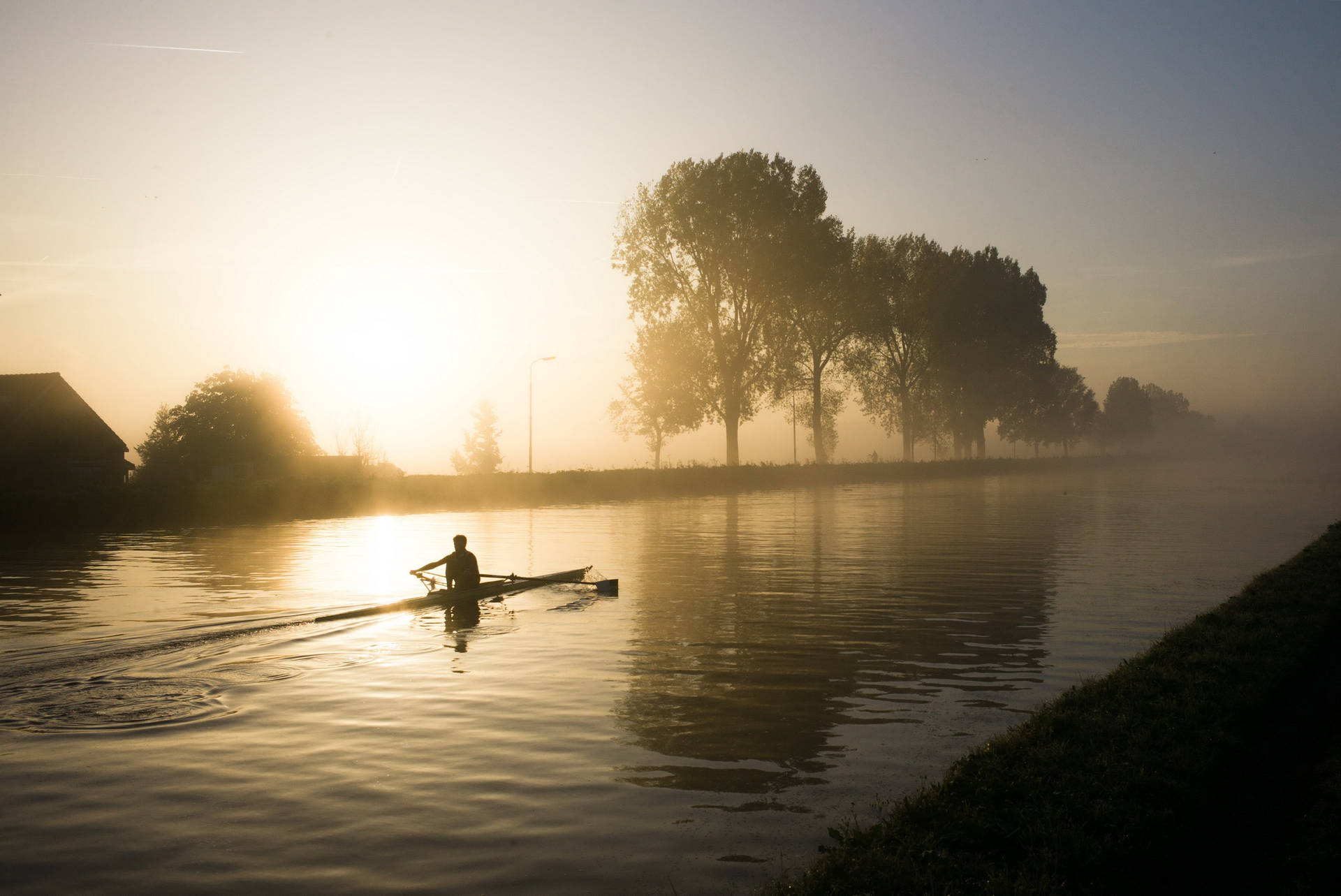 Rowing During Sunrise Background
