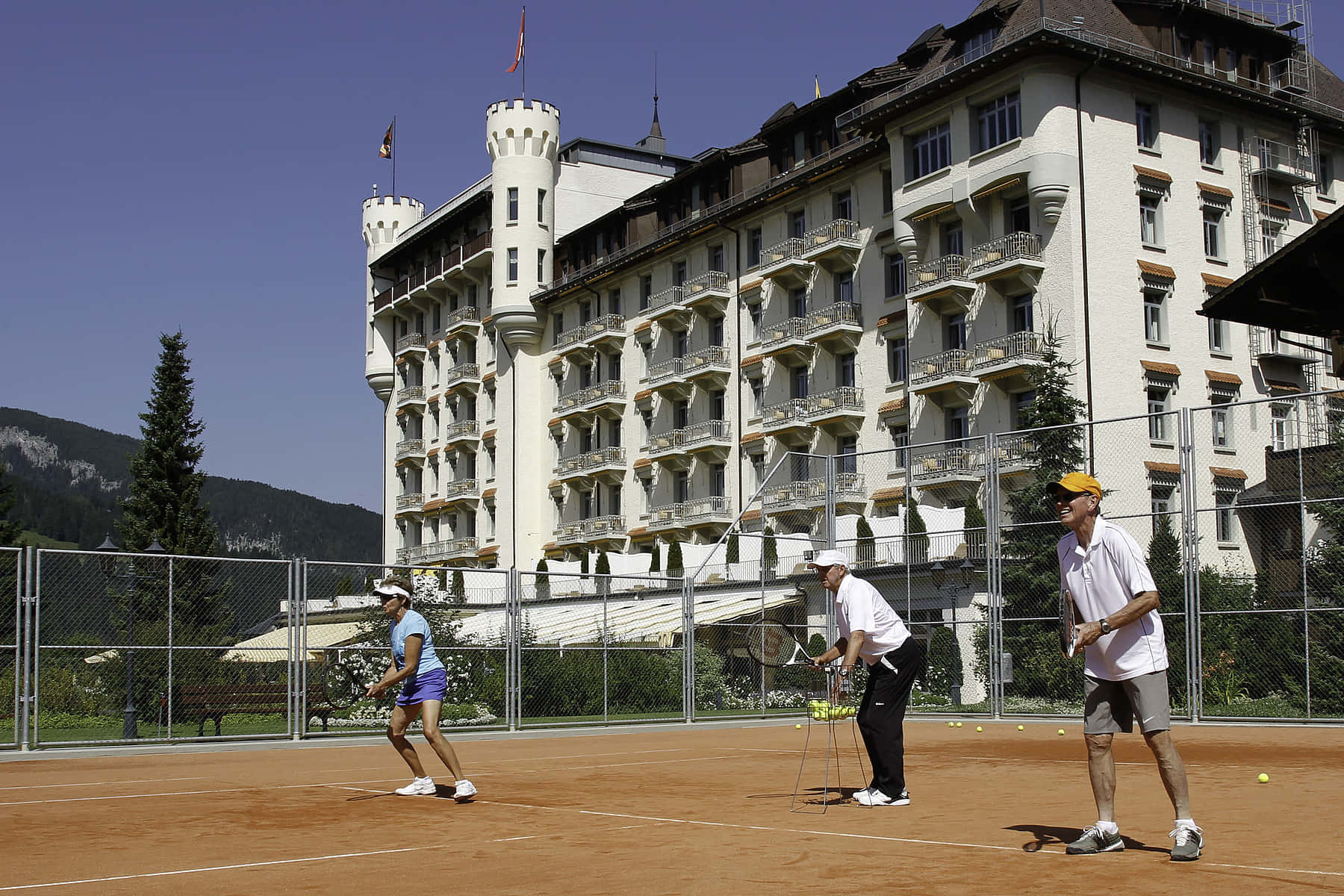 Roy_ Emerson_ Playing_ Tennis_ At_ Historic_ Hotel Background