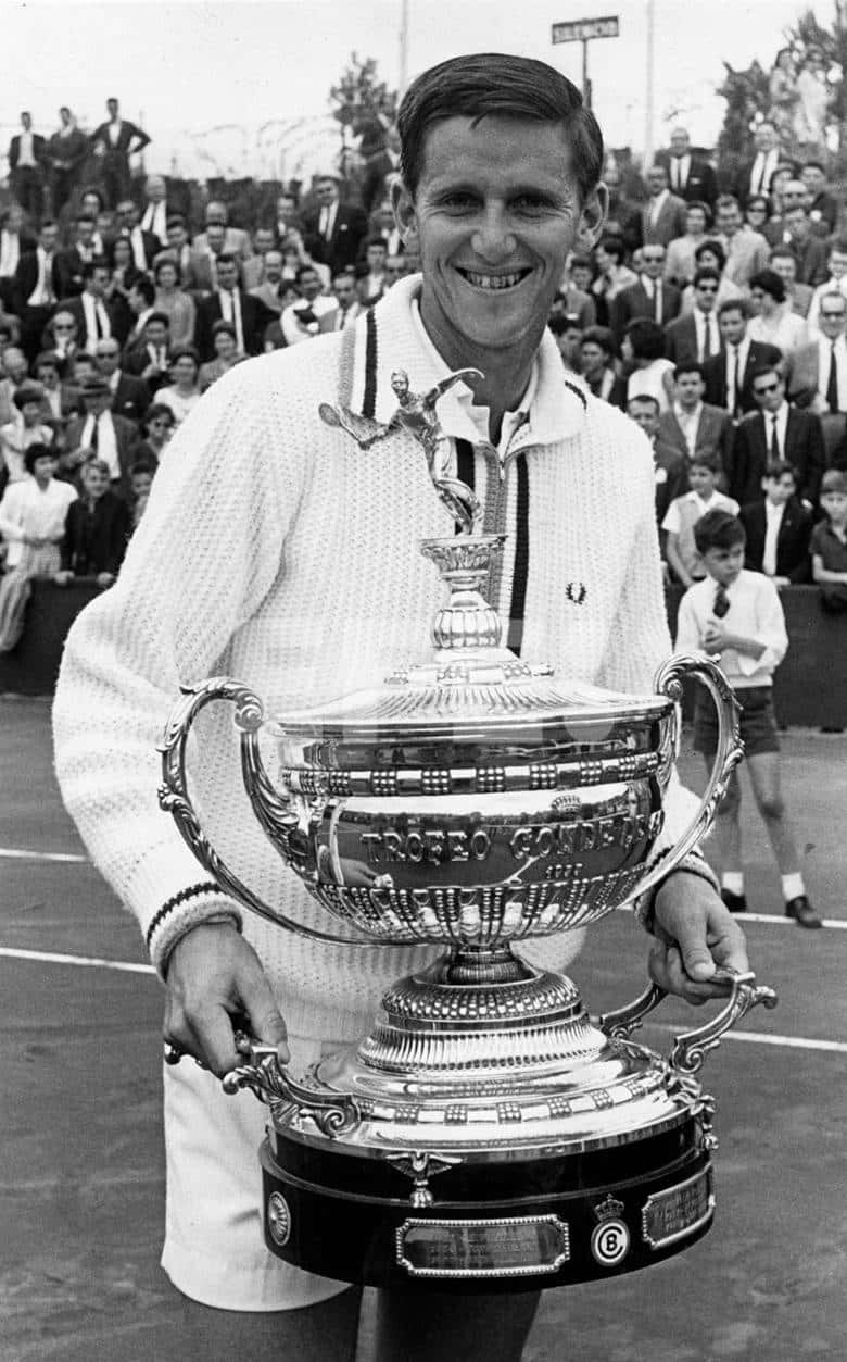 Roy Emerson Tennis Champion With Trophy Background