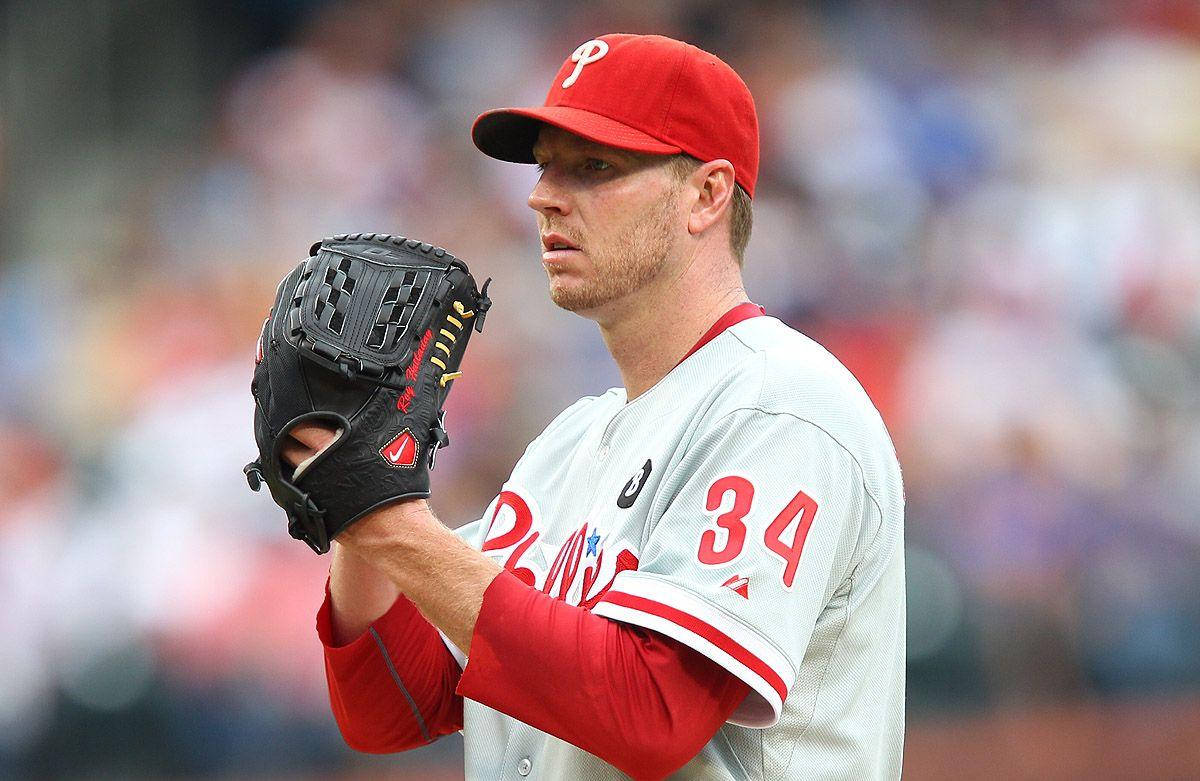 Roy Halladay Adjusting Baseball Glove Background