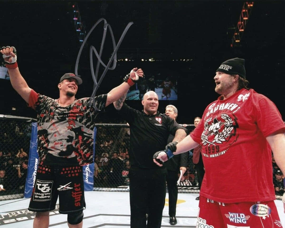 Roy Nelson And Frank Mir Celebrate At Ufc 130 Background