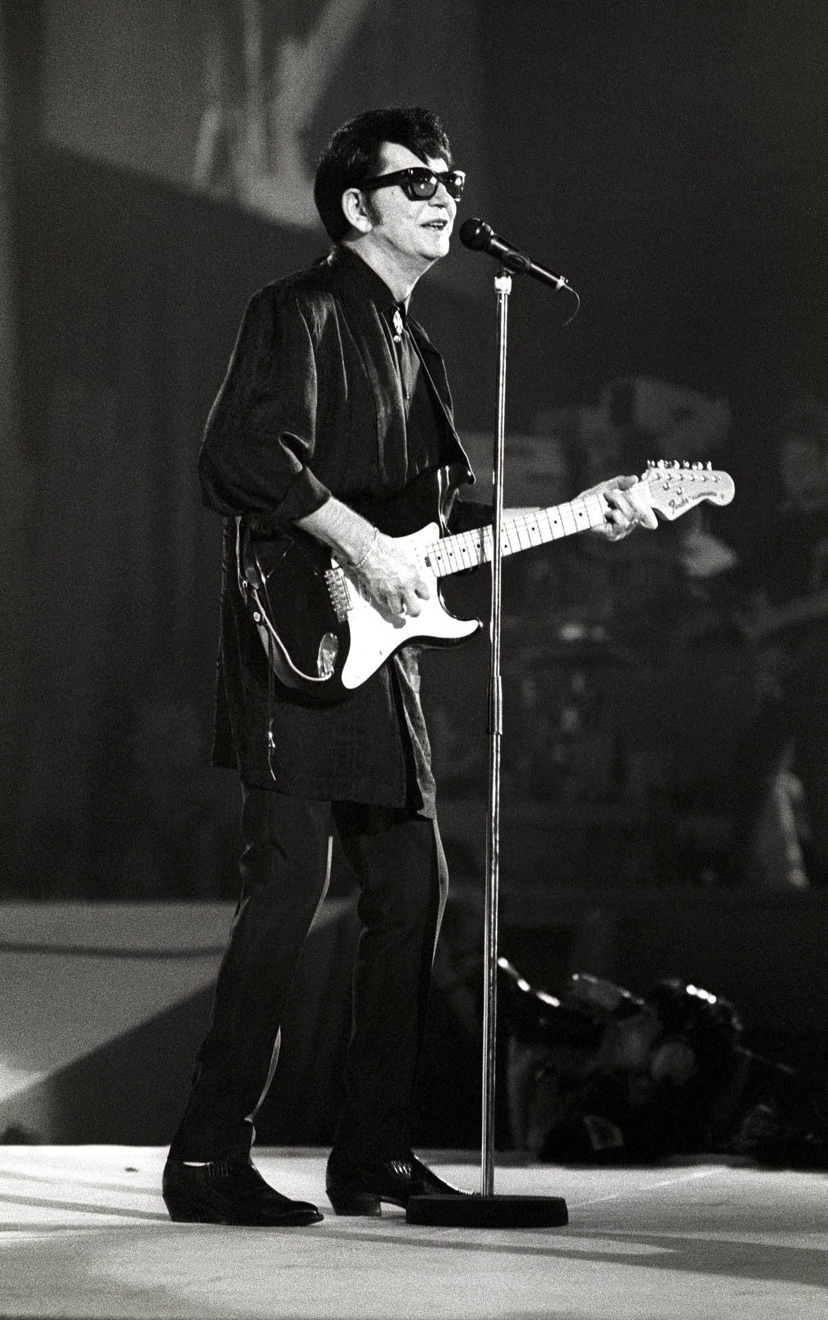 Roy Orbison Live Performance On Stage Background