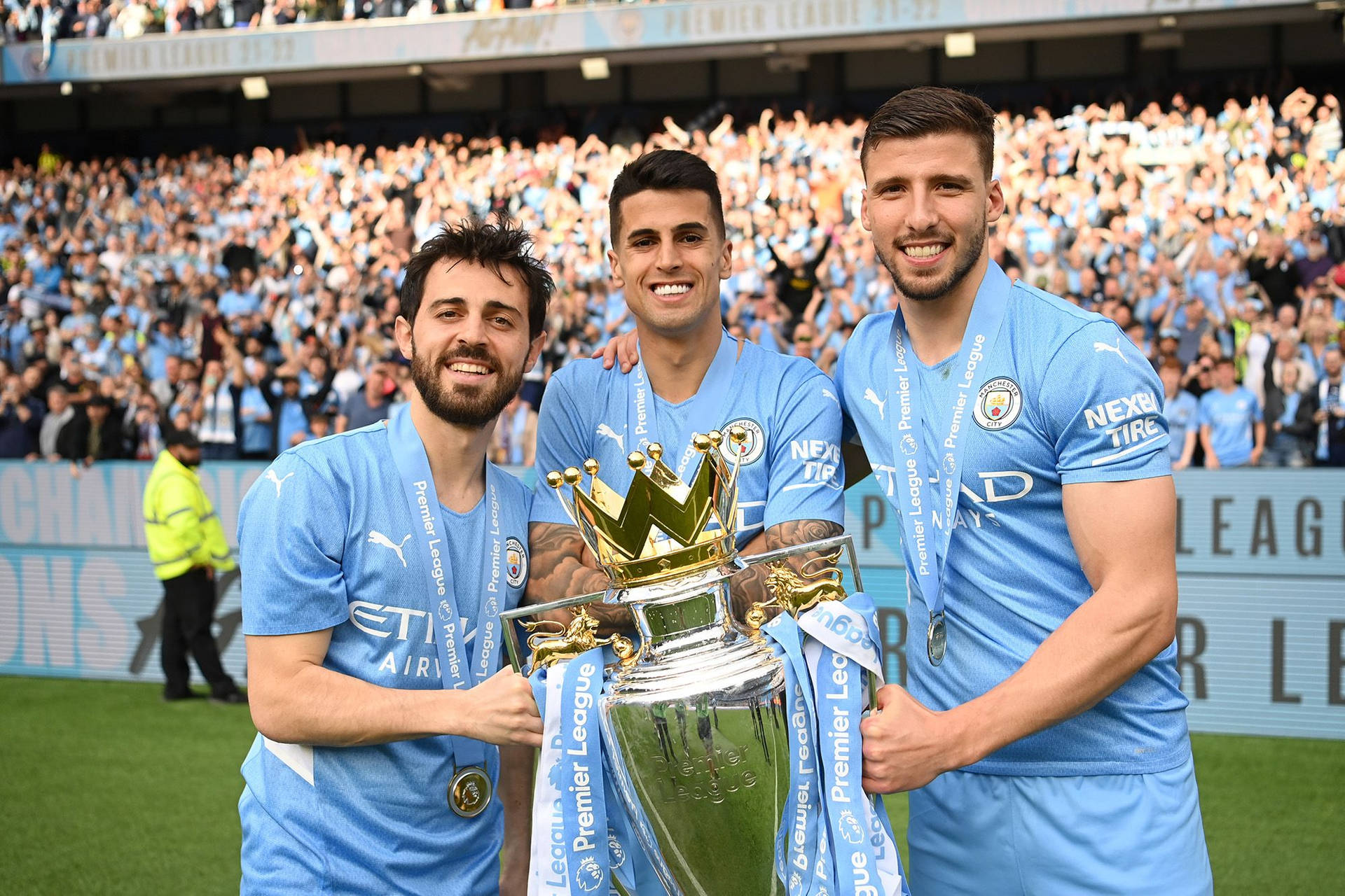 Ruben Dias With His Teammates Holding Trophy Background