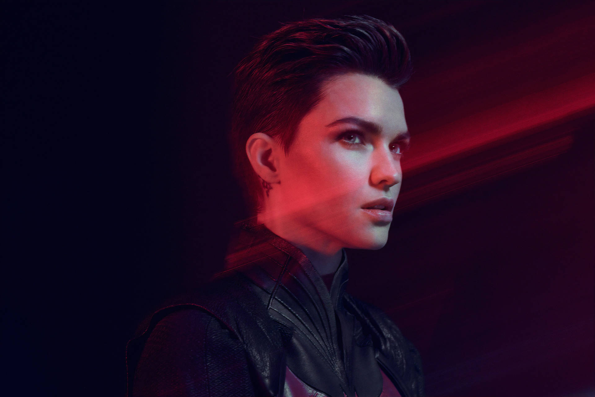 Ruby Rose In Brushed-up Hairstyle Background