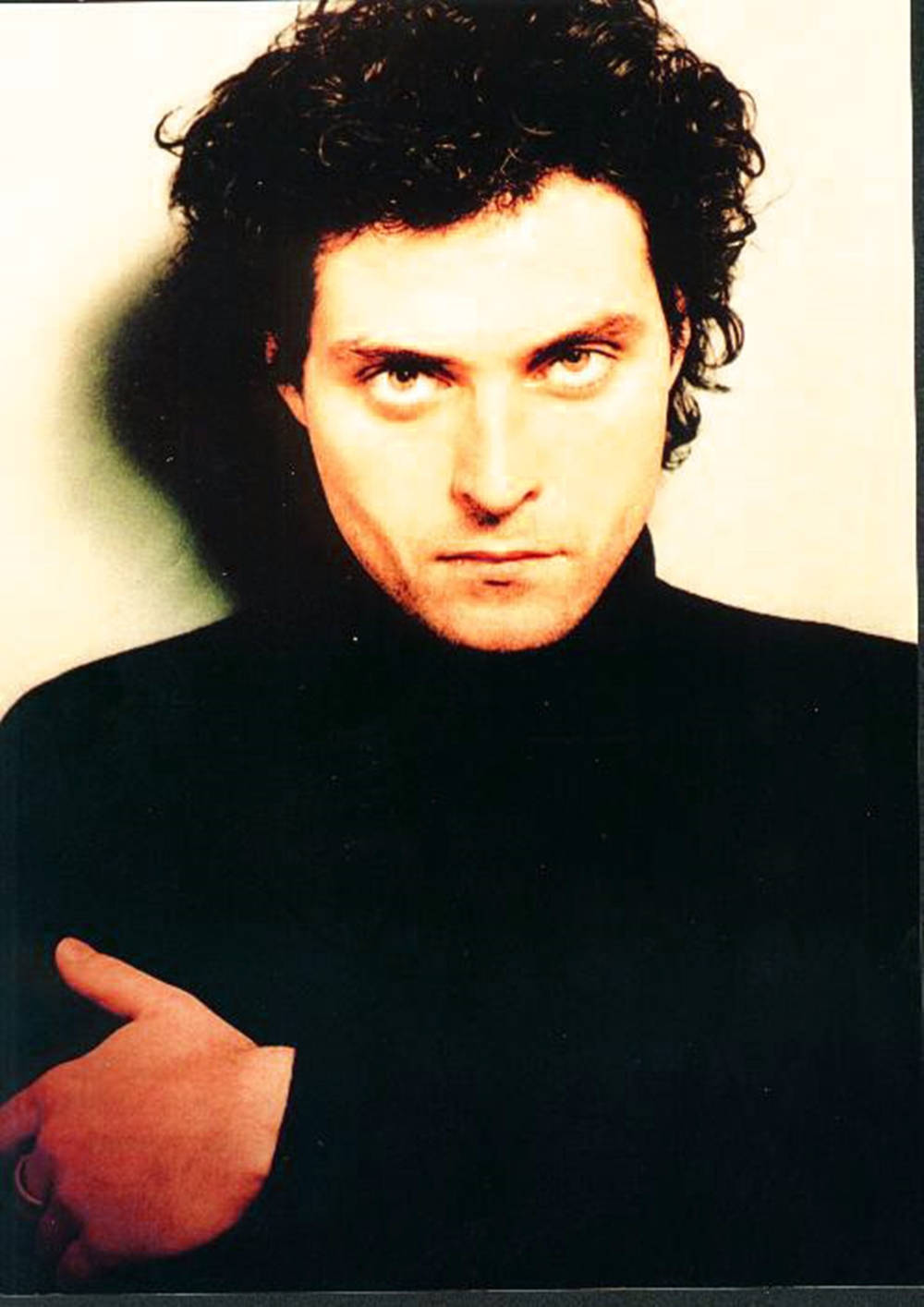 Rufus Sewell Angry Look In Black Turtleneck Background