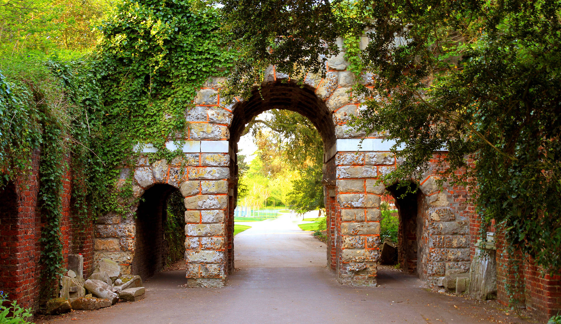 Ruined Arch Entrance In Park Background