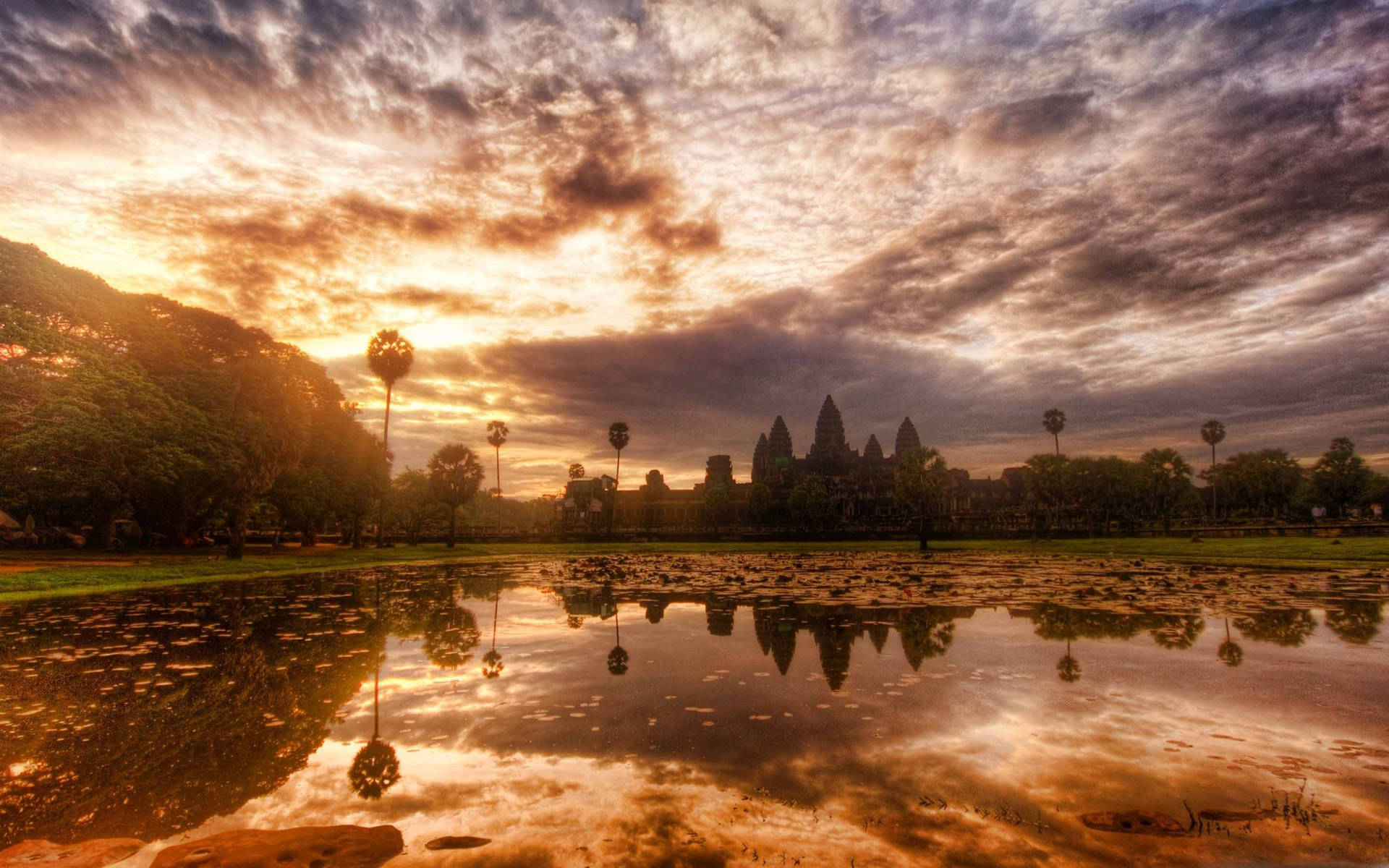 Ruins Of Angkor Wat Below Majestic Sunset Sky