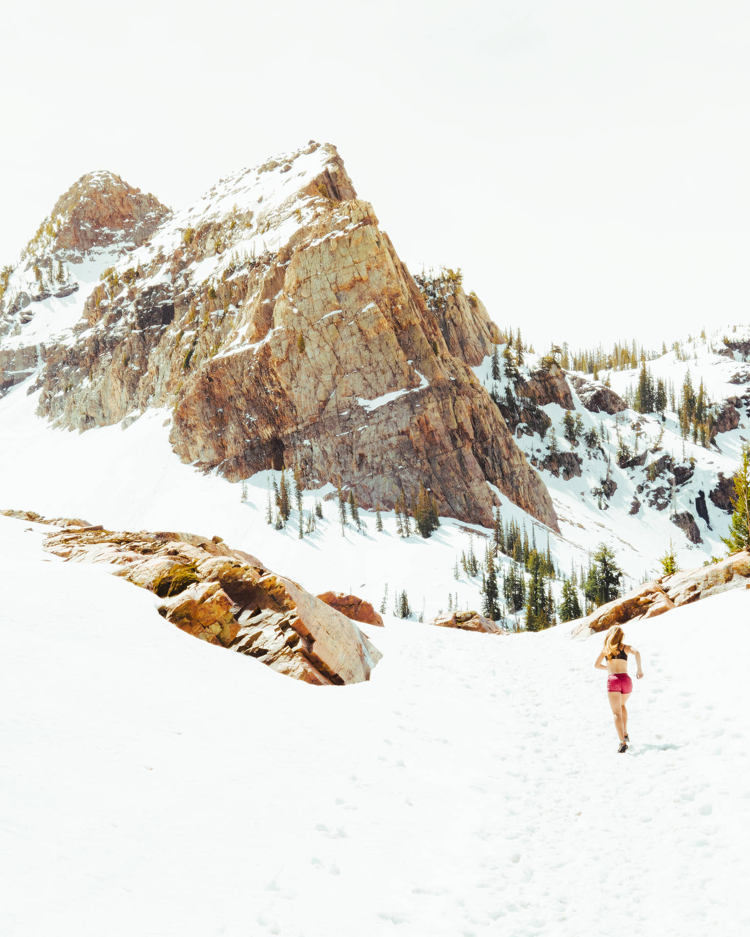 Runner In Snow Mountain Background
