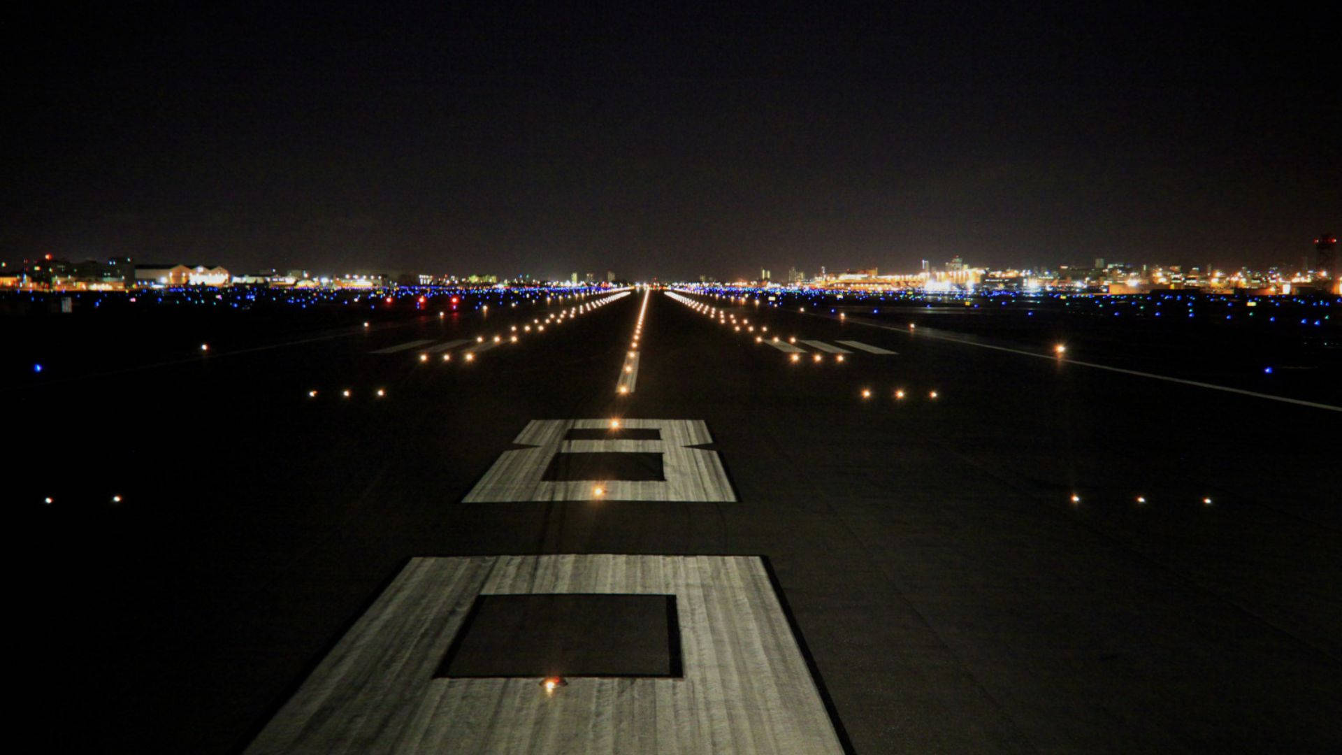 Runway And City Lights Background