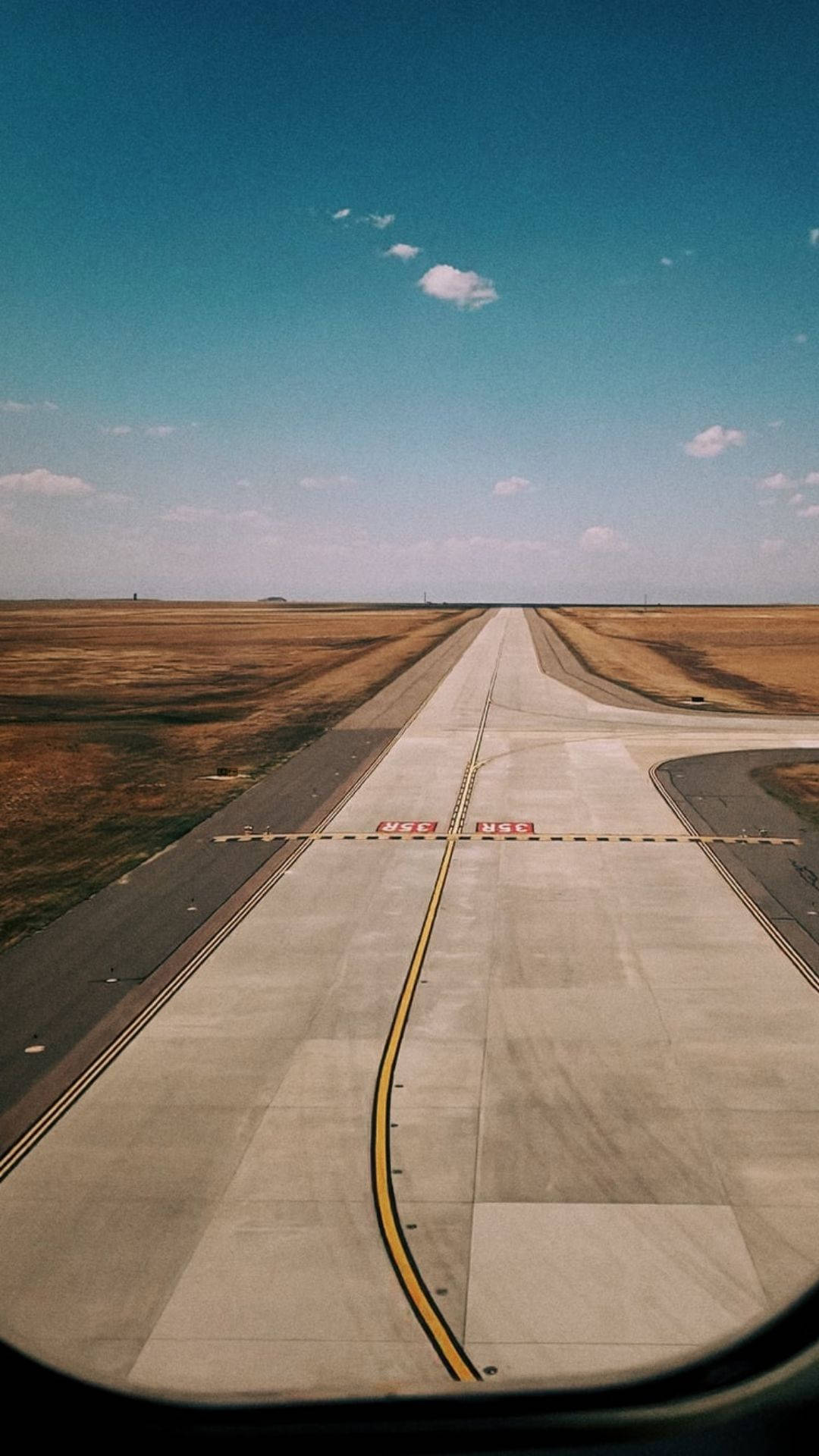 Runway With Yellow Long Lines Background